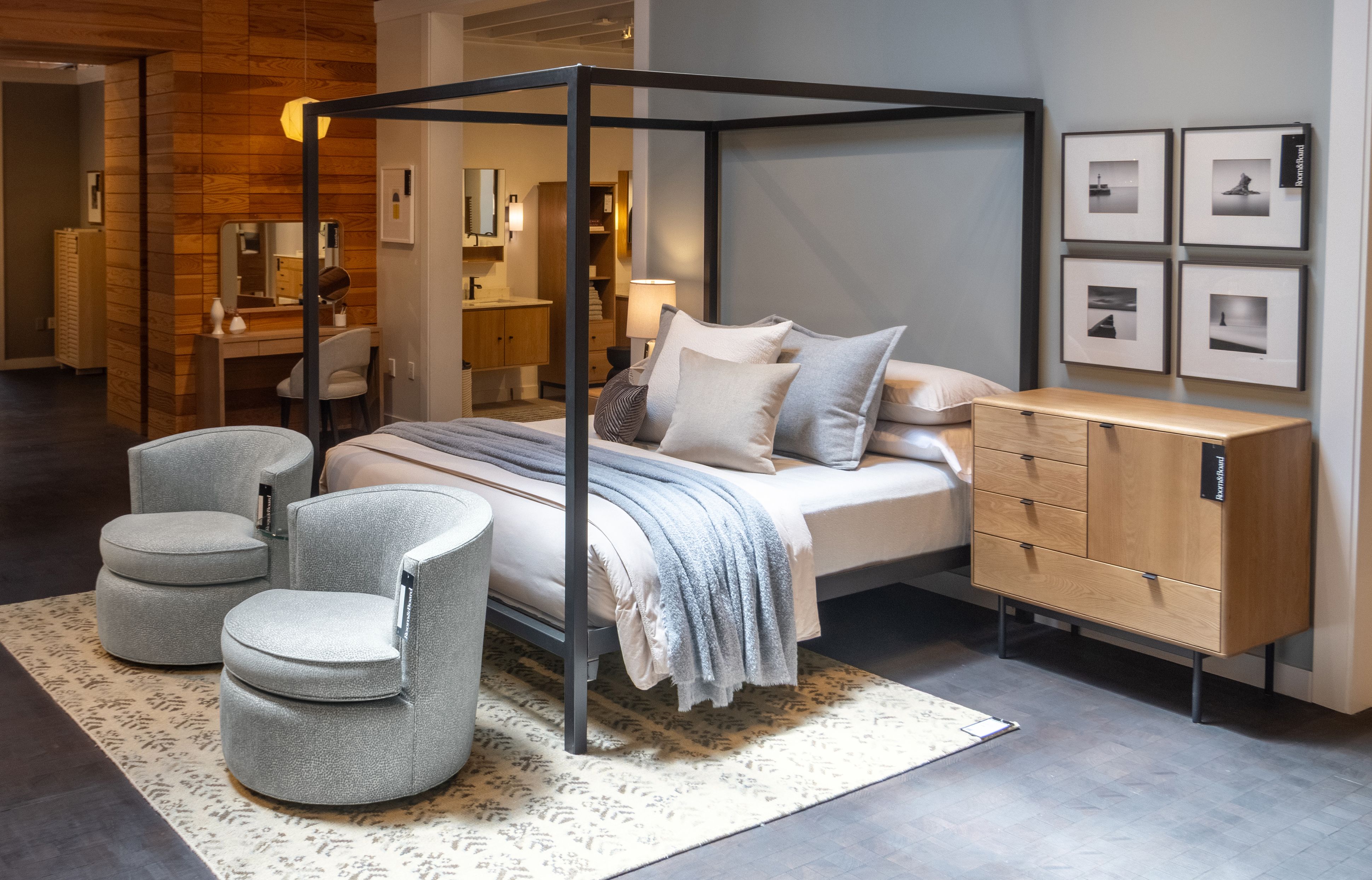 Showroom image with architecture california king standard bed in natural steel and a Hensley dresser in rye on red oak and graphite.