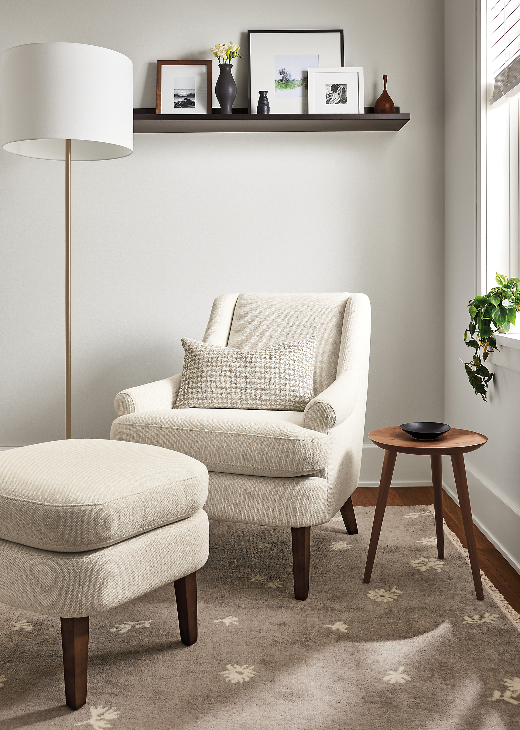 living room with Louise Chair and ottoman in Tepic Ivory, fremont floor lamp.