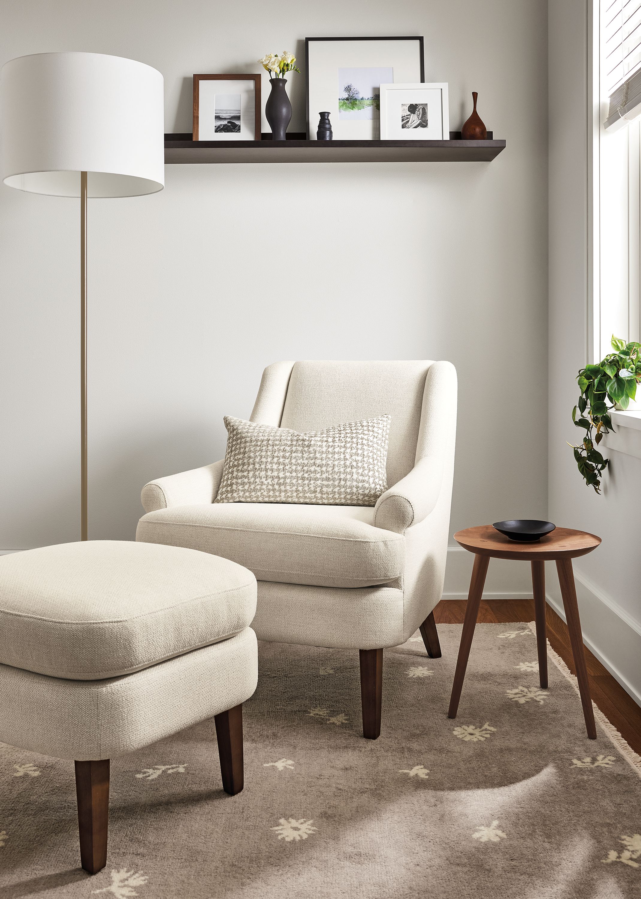 living room with Louise Chair and ottoman in Tepic Ivory, fremont floor lamp.