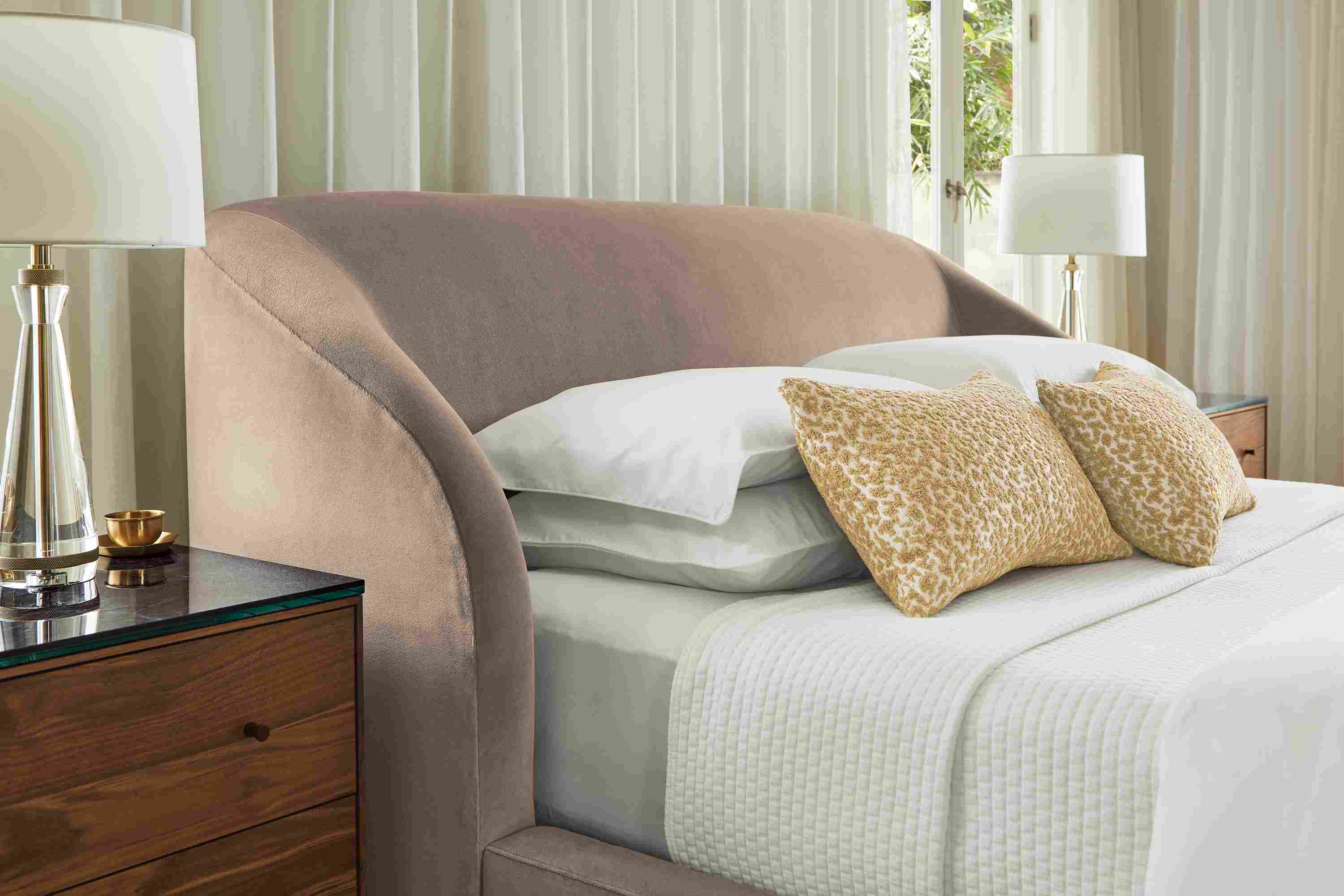 Bedroom with close up of Loxley queen storage bed in Windsor Asphalt and Greenwich throw pillows in camel.