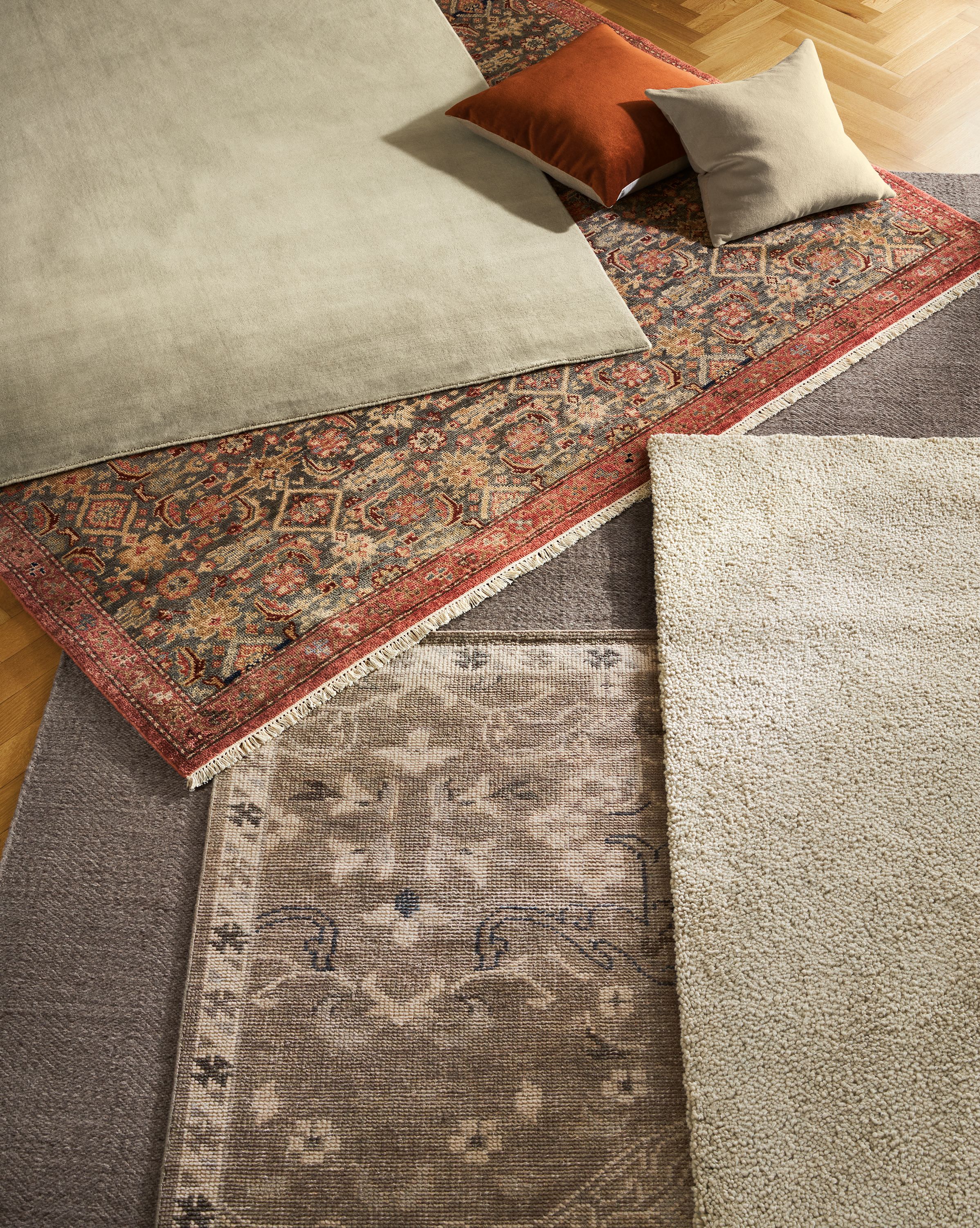 Group of rugs including Luco in silver, Helena in Slate, Avilia in Foxhound, Ophelia in pewter and Arden in Oatmeal.