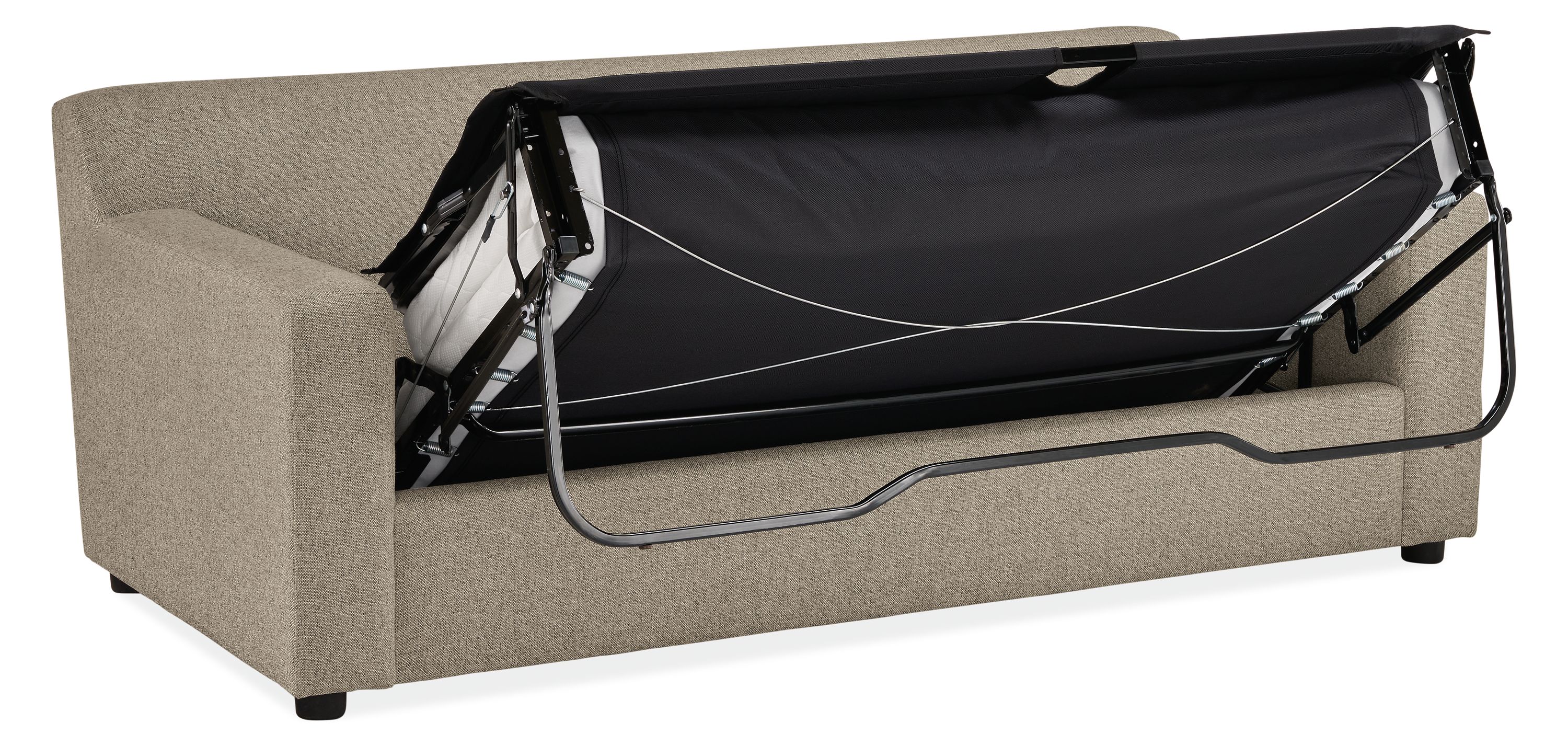 Ludlow wide arm sleeper sofa in tatum grey shown with pull-out bed partially extended showing bottom liner of mattress.