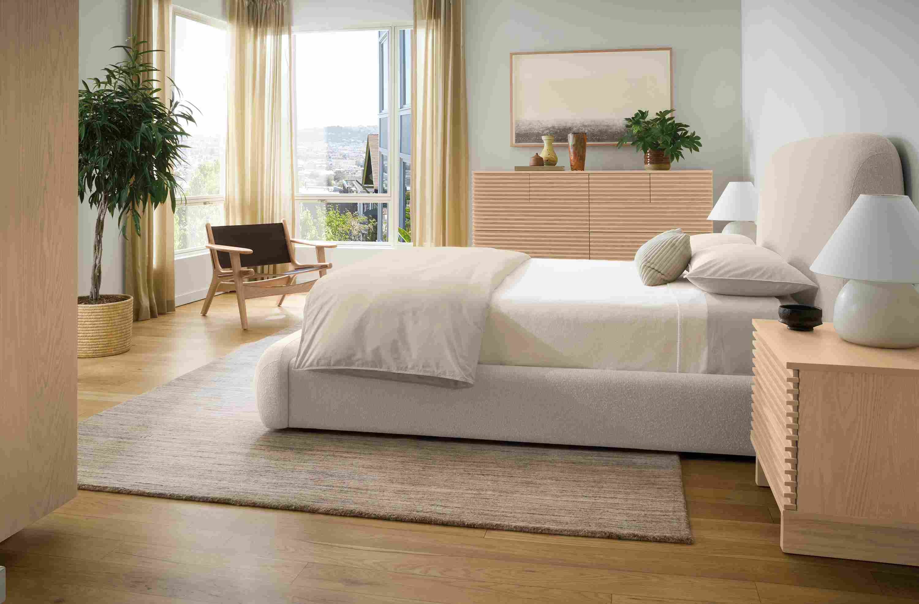 Bedroom with Luna queen storage bed in conley natural and coles nightstand and dresser in salt on red oak.