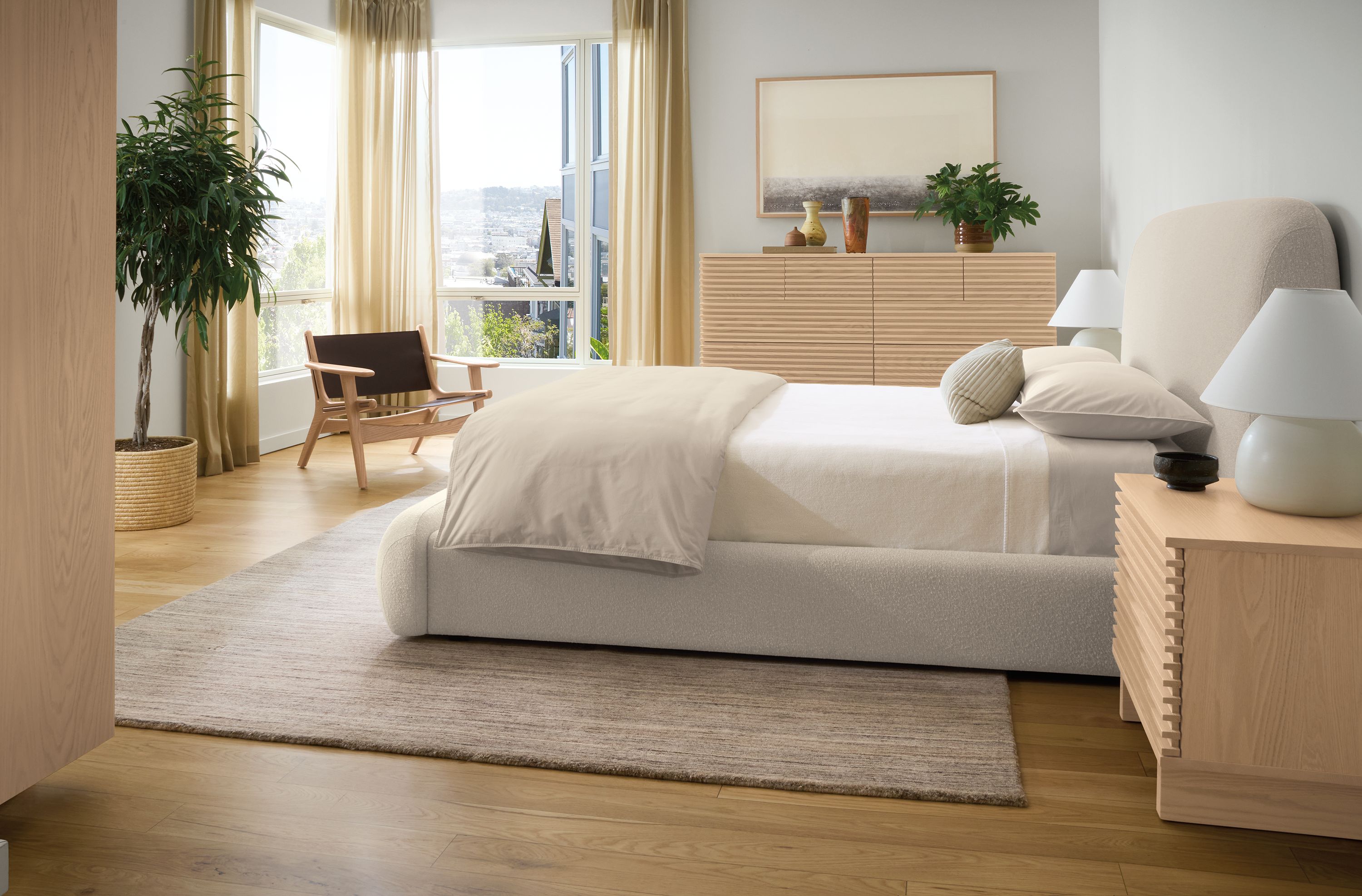 Bedroom with Luna queen storage bed in conley natural and coles nightstand and dresser in salt on red oak.