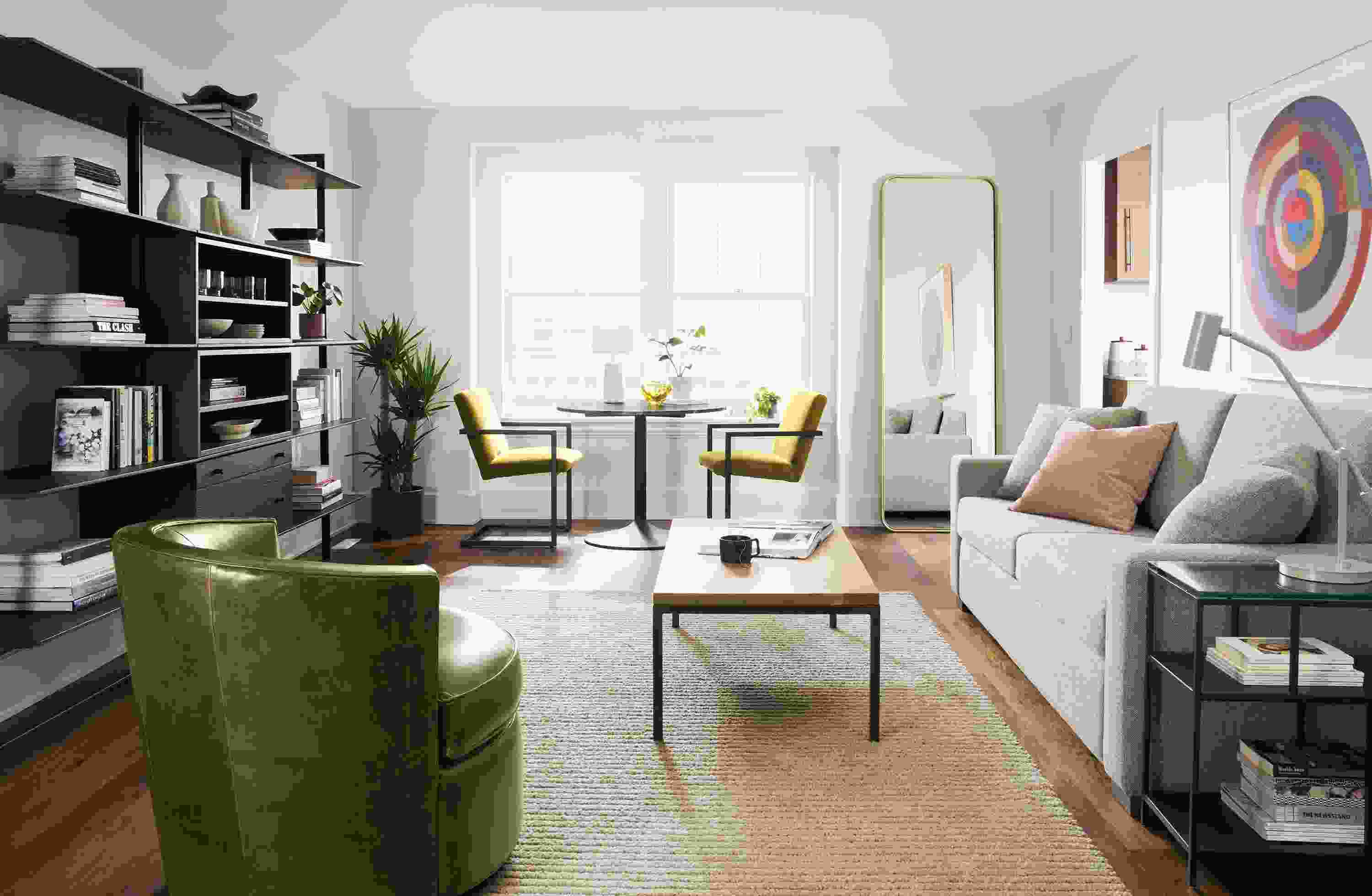 Living room including Lyndale floor mirror in brushed gold powdercoat and Metro sleeper sofa in tatum grey.