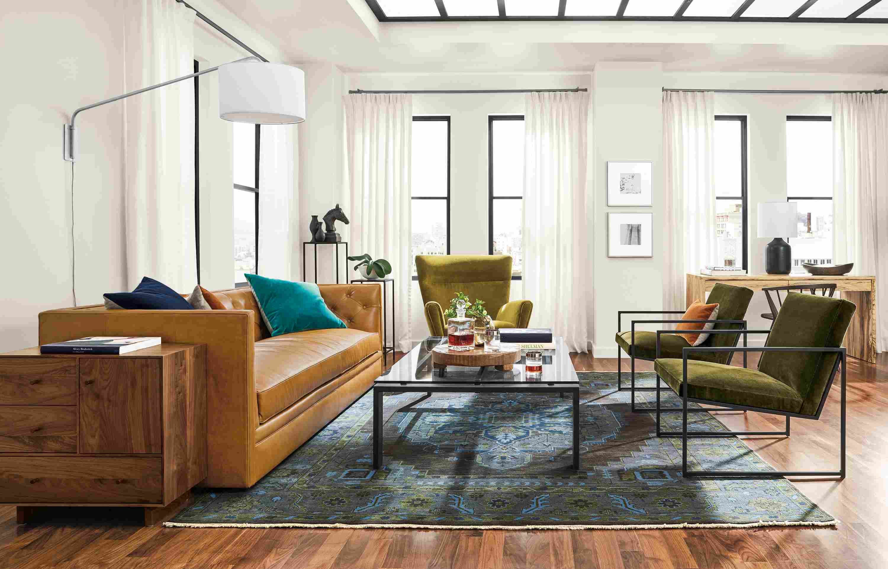 Living room with Macalester sofa in Portofino Cognac, 2 Novato chairs in Vance Olive and Boden chair in Vance Mustard.