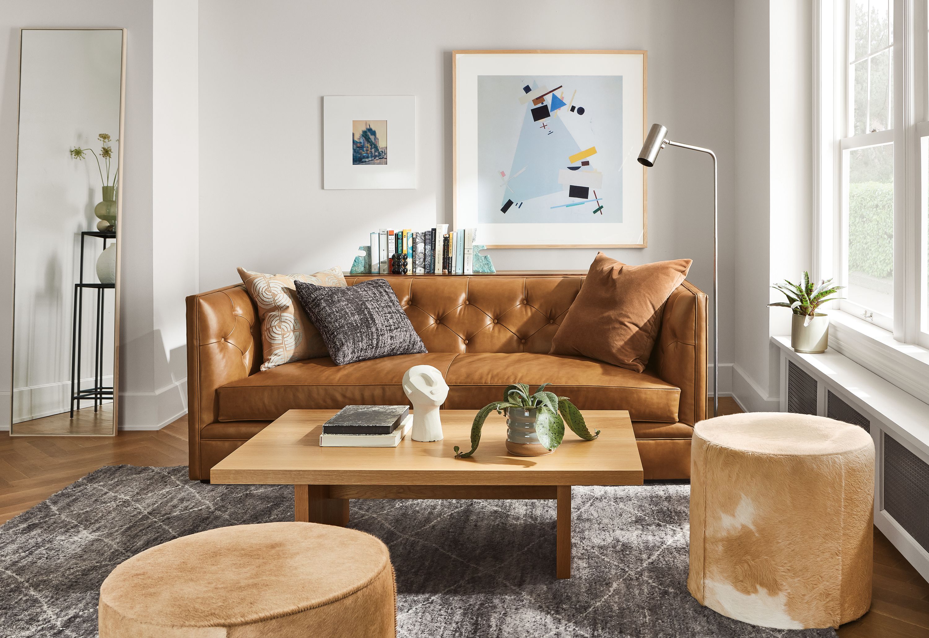 Living room with Macalester 80-wide sofa in Portofino Cognac, Corbett coffee table in white oak and Kalindi rug in charcoal.