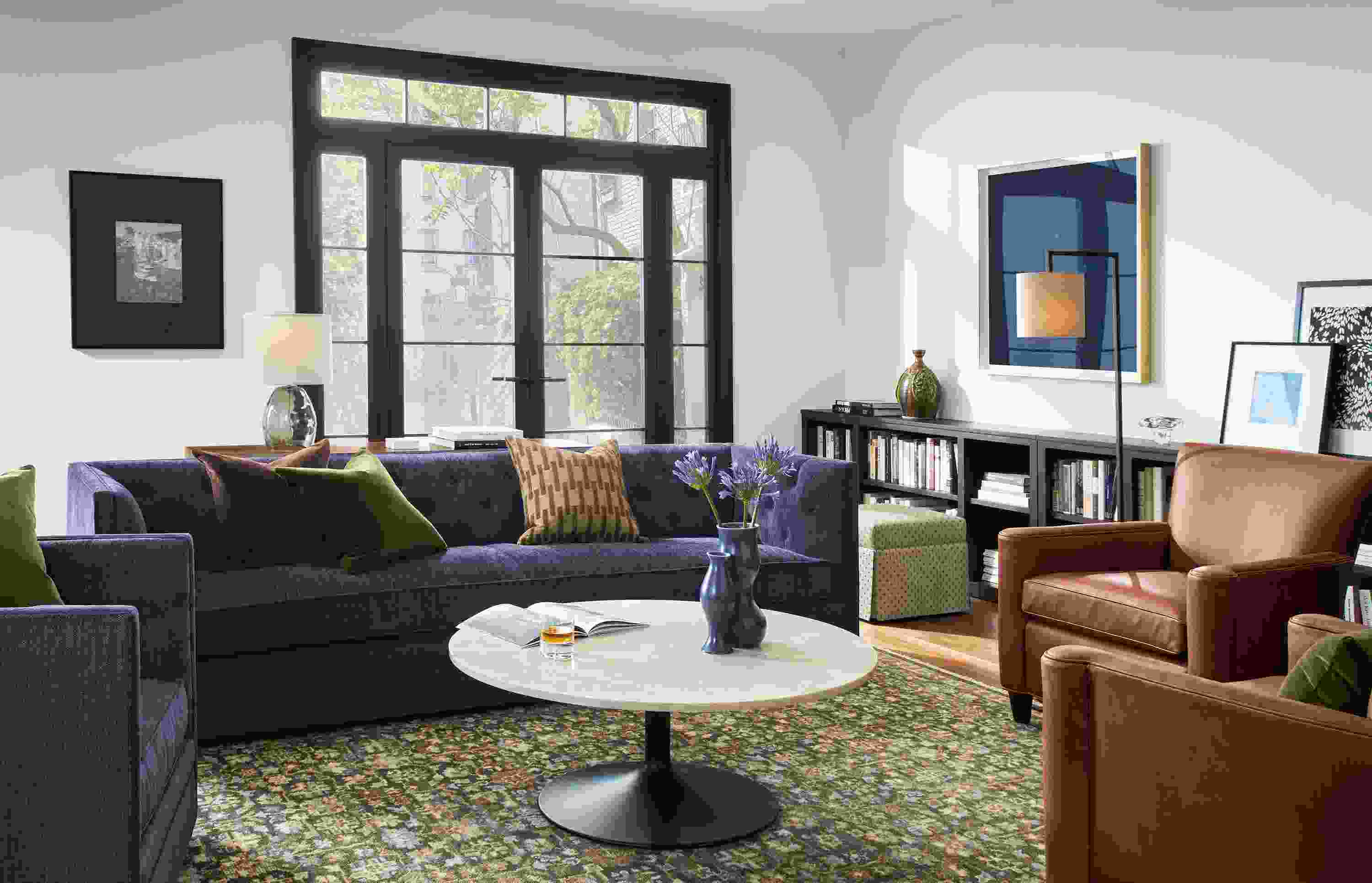 Living room with Macalester sofa and swivel chair in Olmsted Indigo and 2 Savoy chairs in Sarto Cognac.