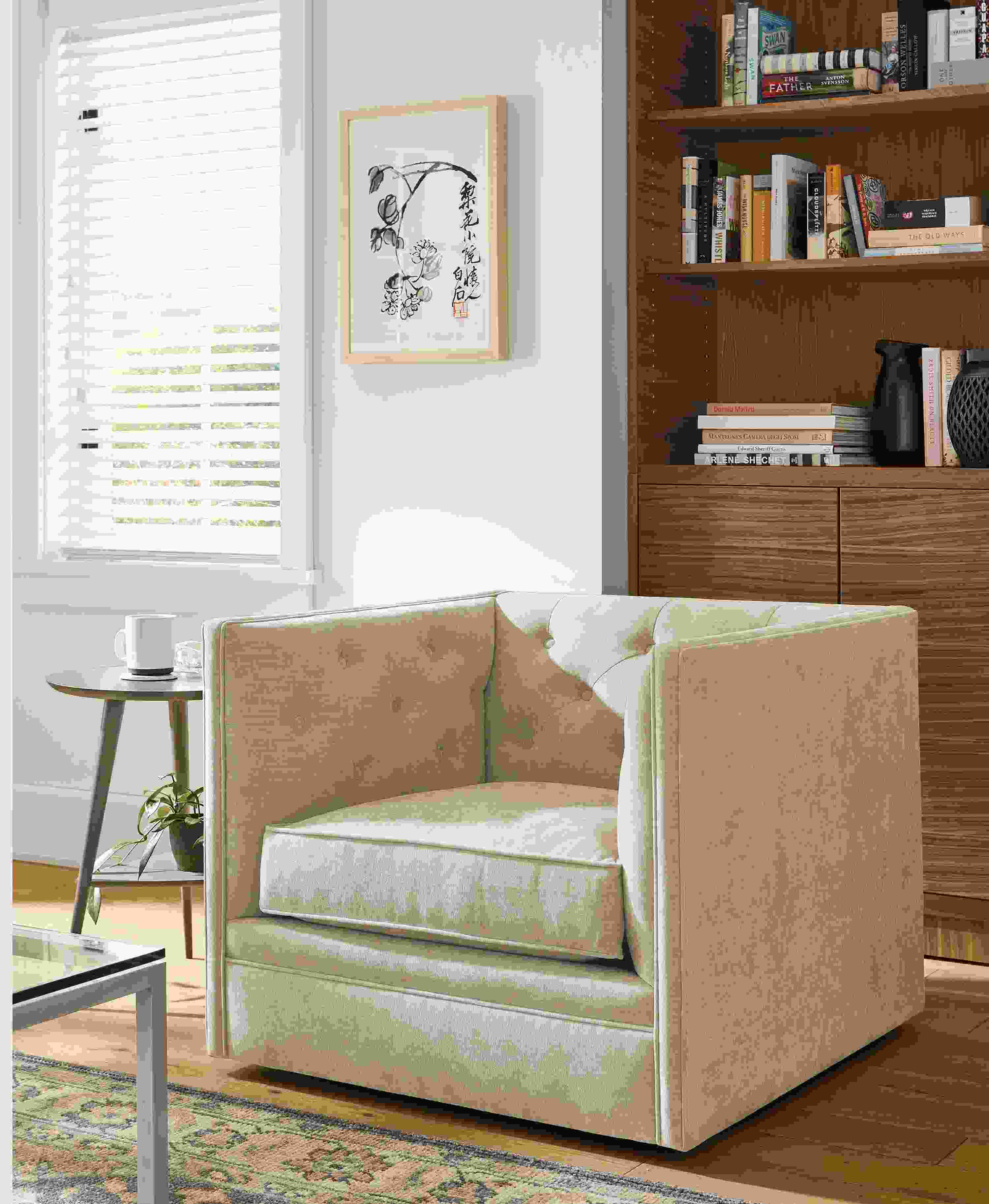 Living room with Macalester swivel chair, Qi Baishi artwork, Taylor bookcase in walnut and Rae end table.