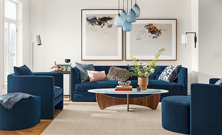 Detail of Macalester sofa in banks denim in living room with 2 Silva chairs in banks denim.