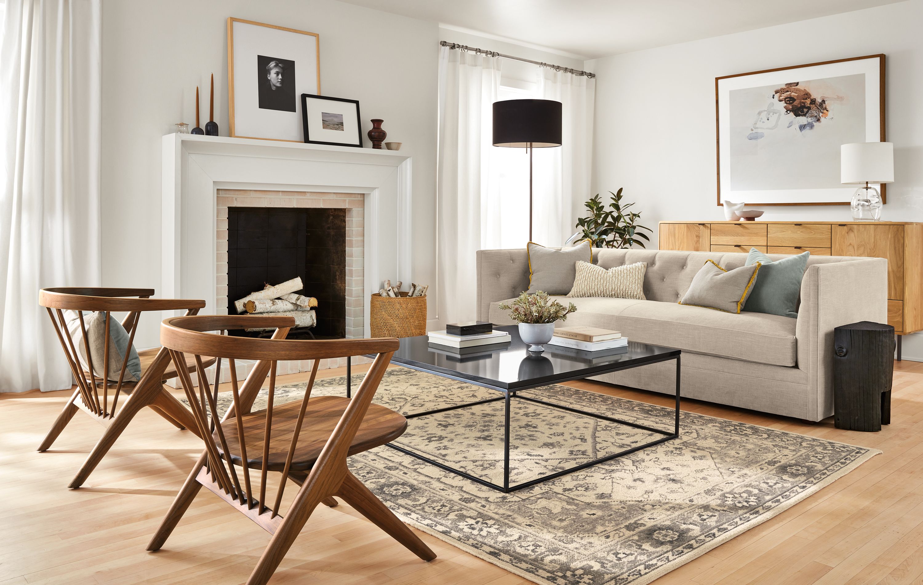 room setting with macalaster sofa in mori oatmeal fabric and two soren chairs in walnut