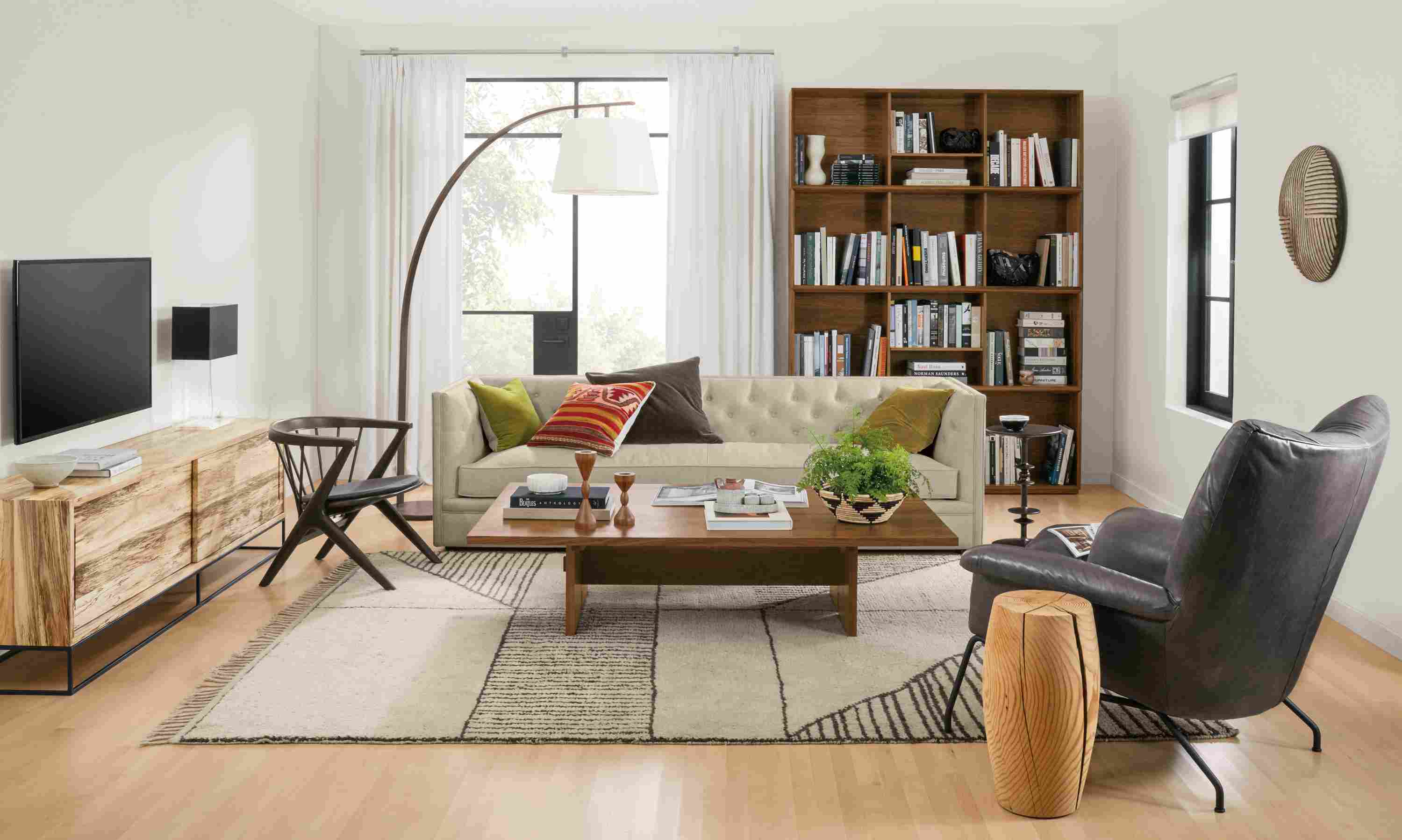 Living room with Macalester sofa in Sumner Linen, Paris chair and ottoman in Vento Smoke and streeter lamp in walnut.