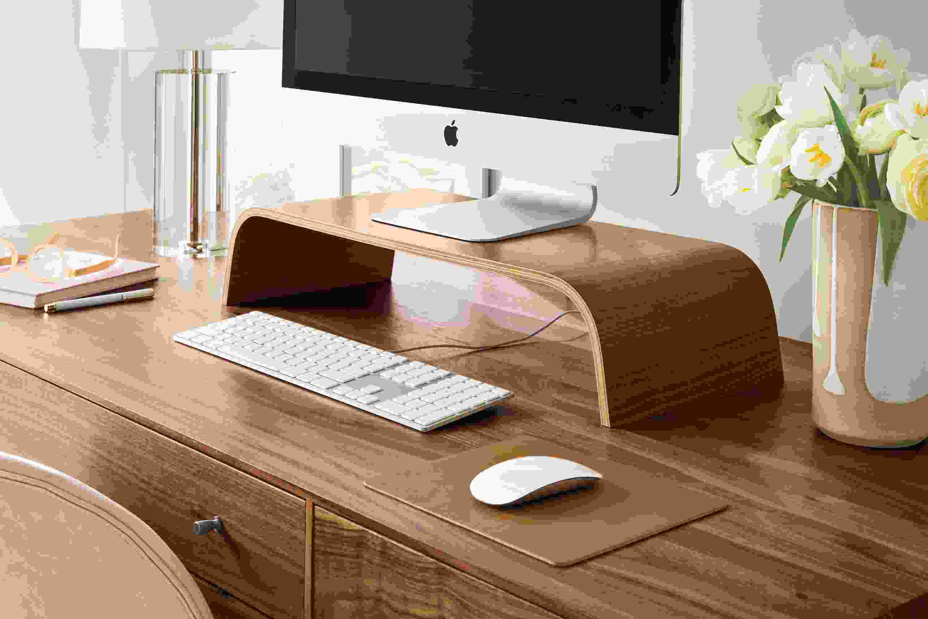 Mackey monitor riser in walnut on a Hudson desk in walnut.