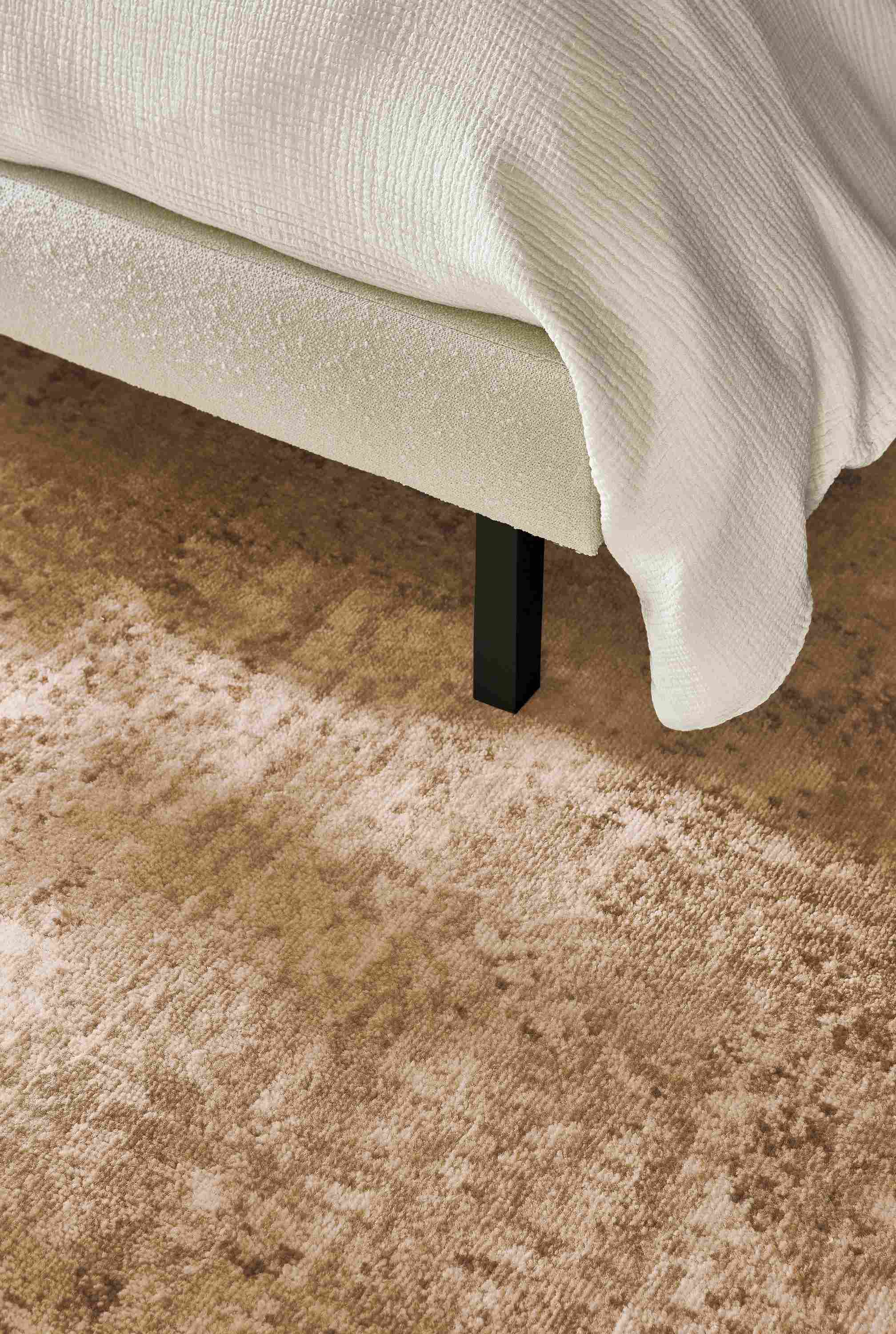 Detail of Makali 8 by 10 rug stone and Ella queen bed in Declan Ivory.