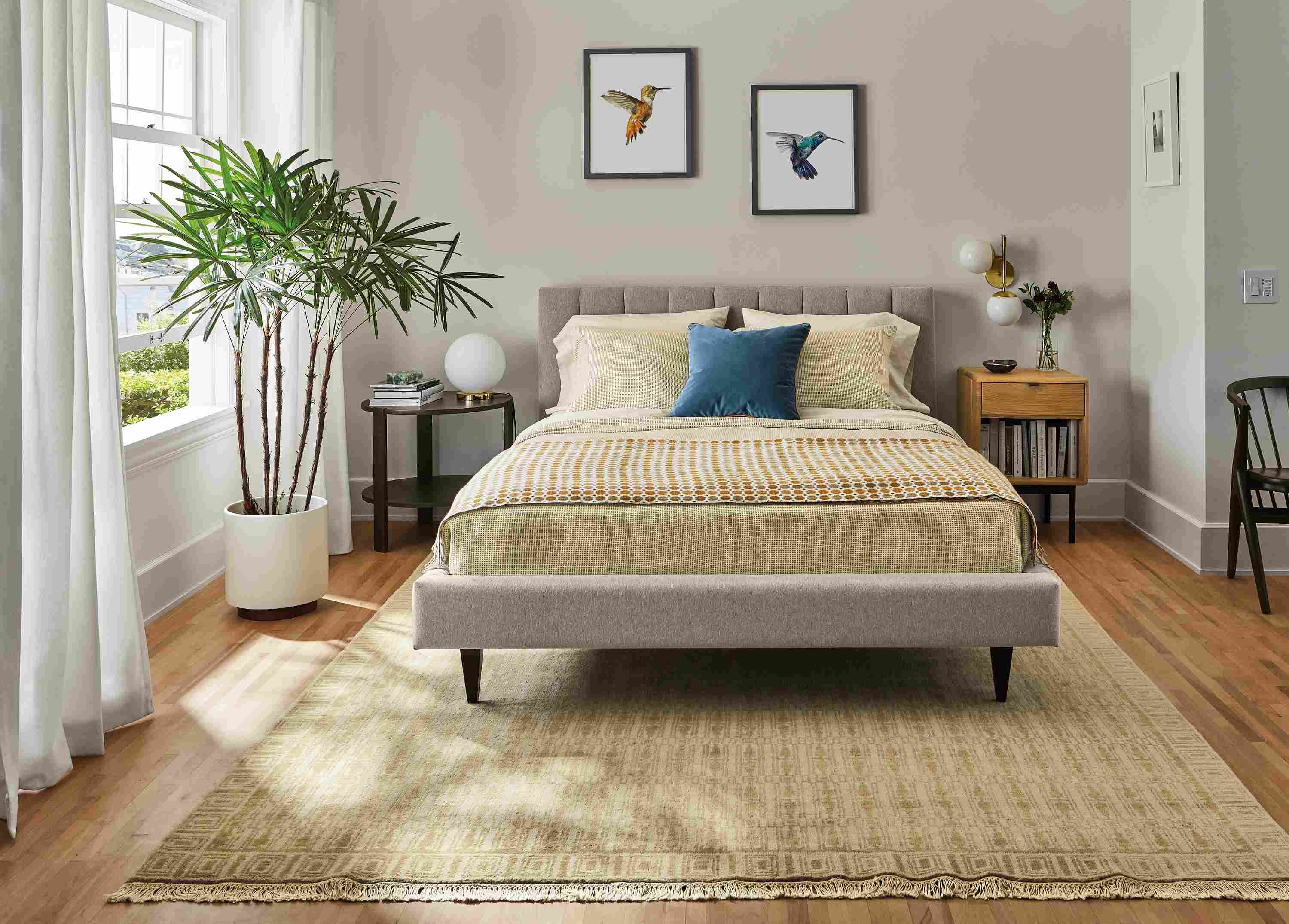 Bedroom with Mara coverlet and sham in citron/ivory, Hartley bed in Flint Ivory and Tulum rug in wheat.