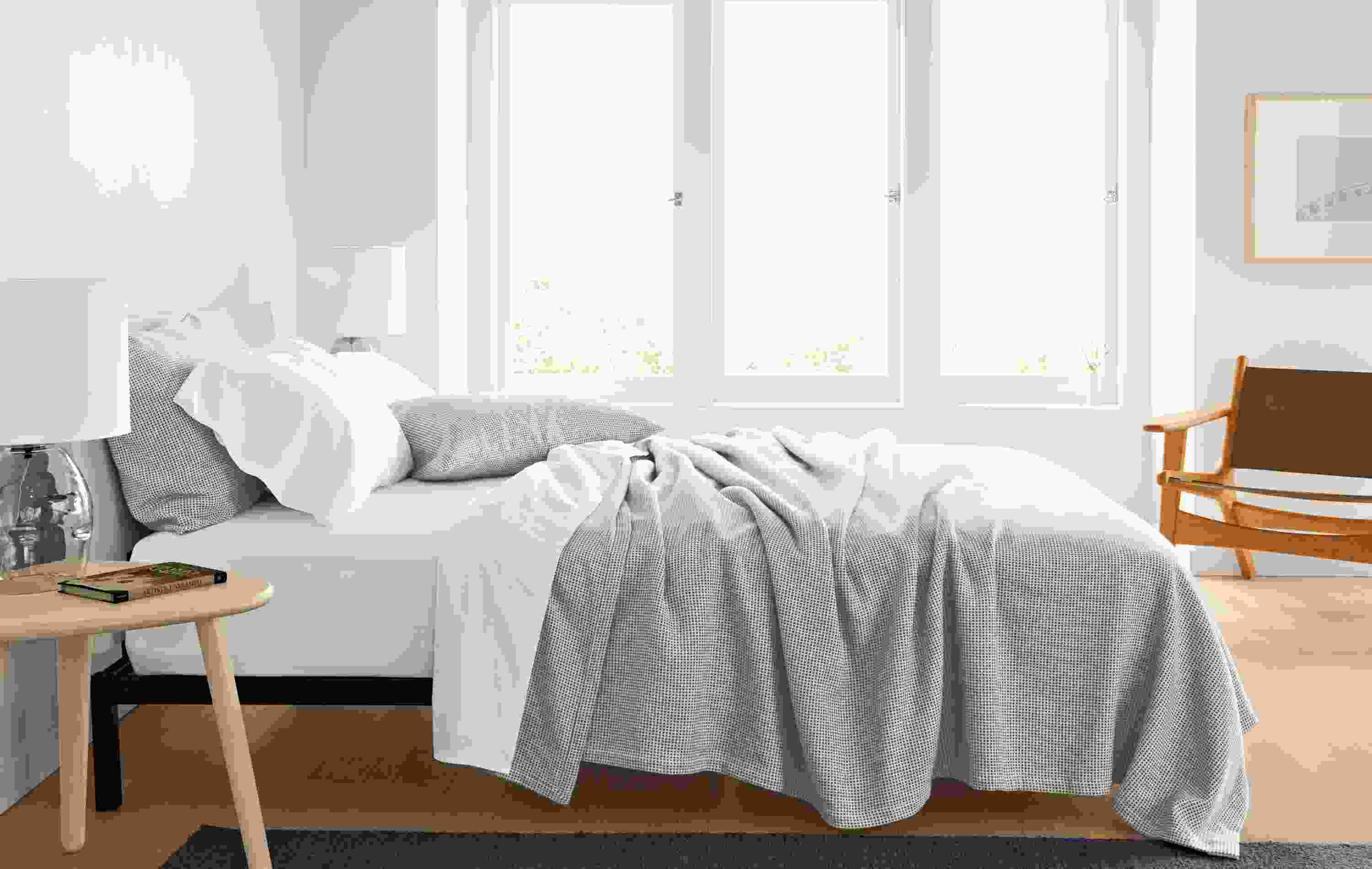 Bedroom with Mara coverlet and sham in ivory/grey on a Copenhagen queen bed.