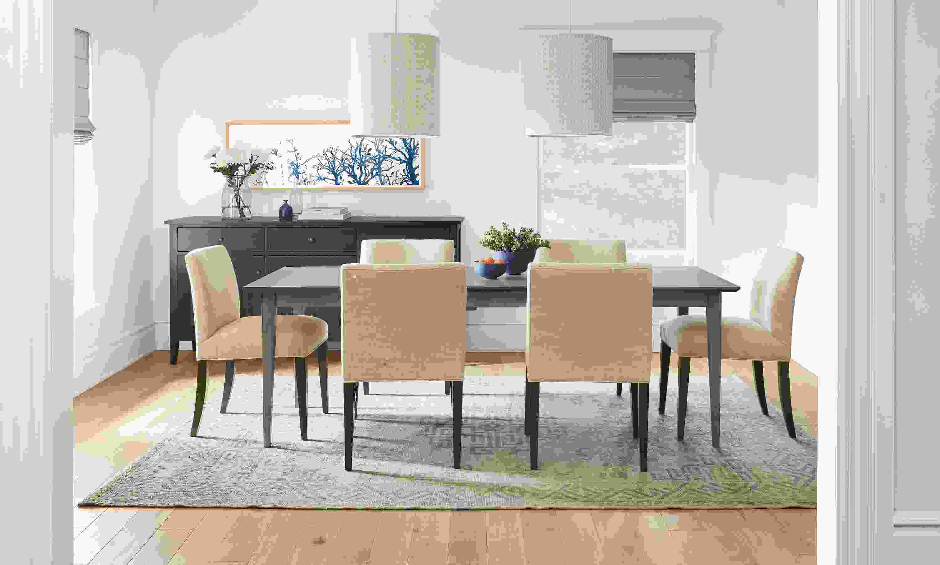 Dining room with Adams table in shell and 6 Marie side chairs in total natural.