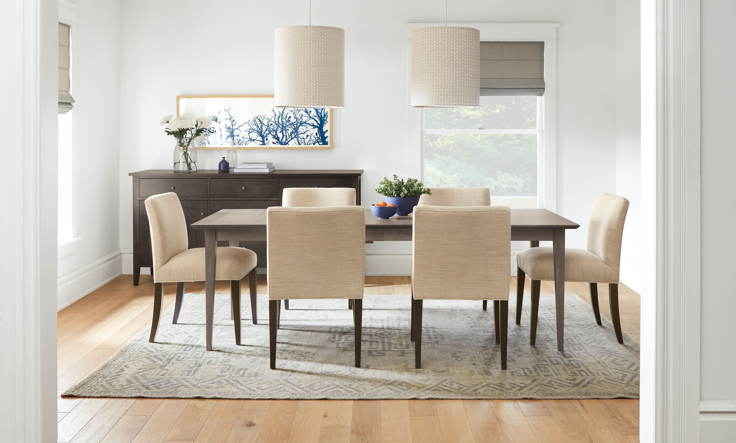 Dining room with Adams table in shell and 6 Marie side chairs in total natural.