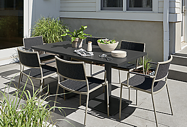 Two Maris 32-square outdoor tables in graphite with Plat chairs in Slate with taupe frame.