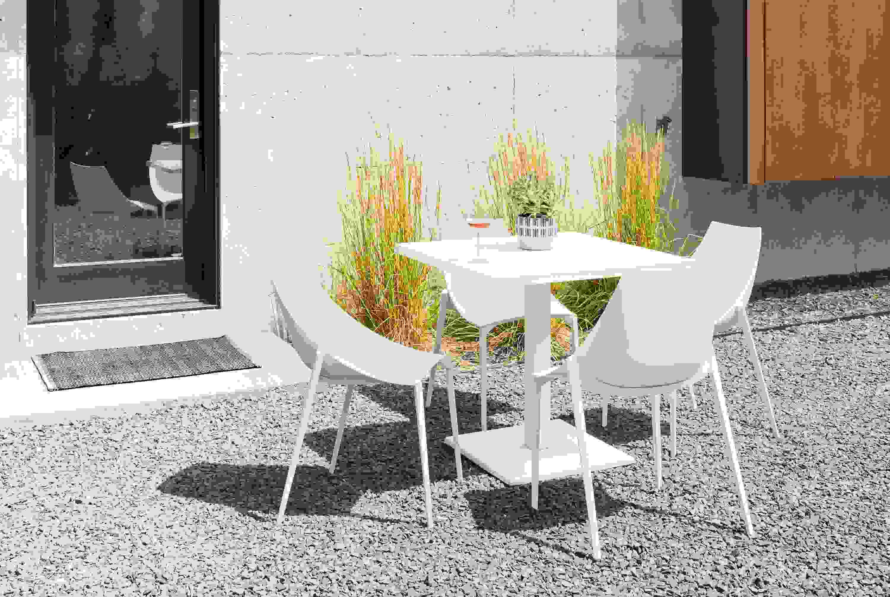 Detail of Maris square table in white.
