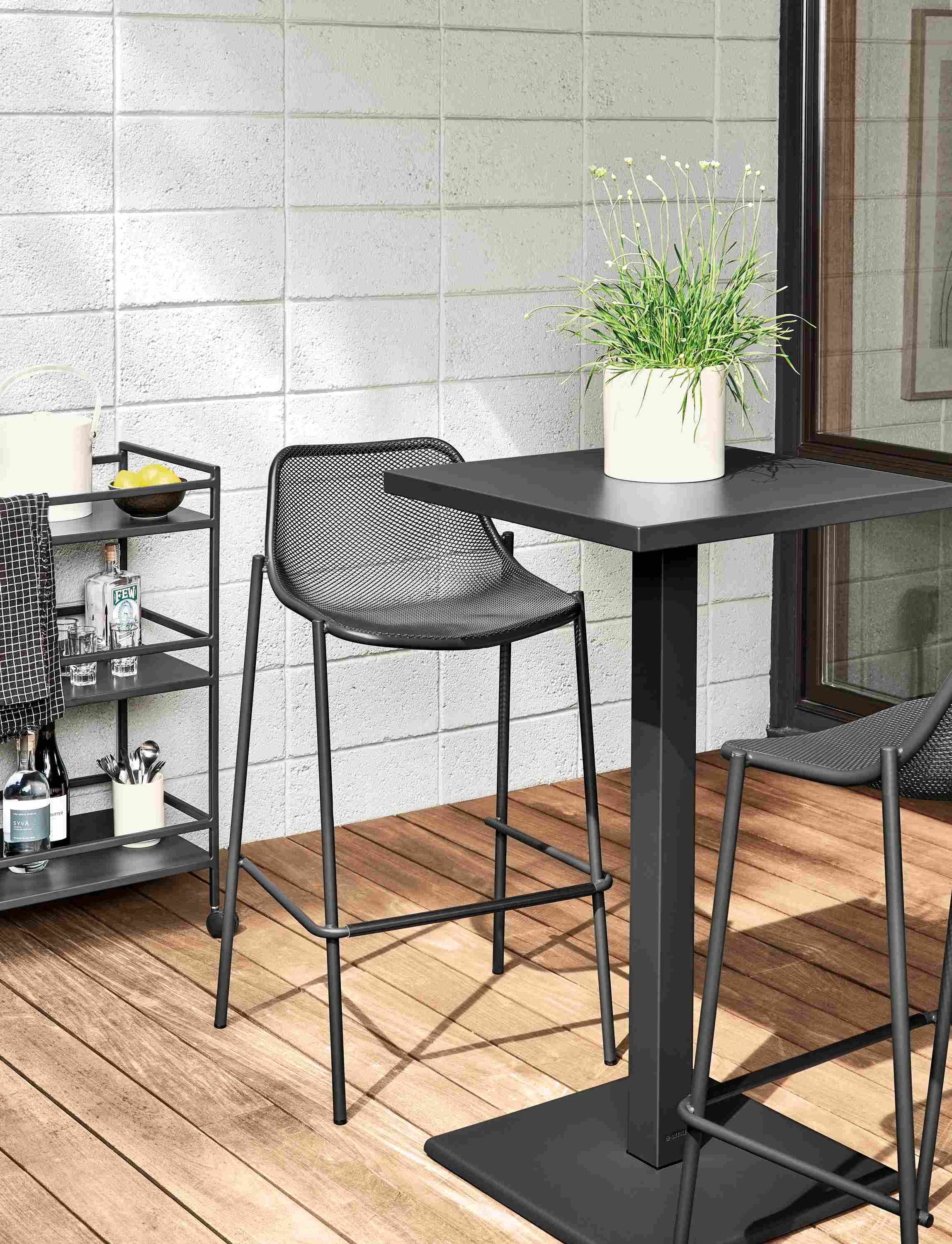 Detail of Maris square bar table, Slim outdoor bar cart and Soleil bar stools all in graphite.