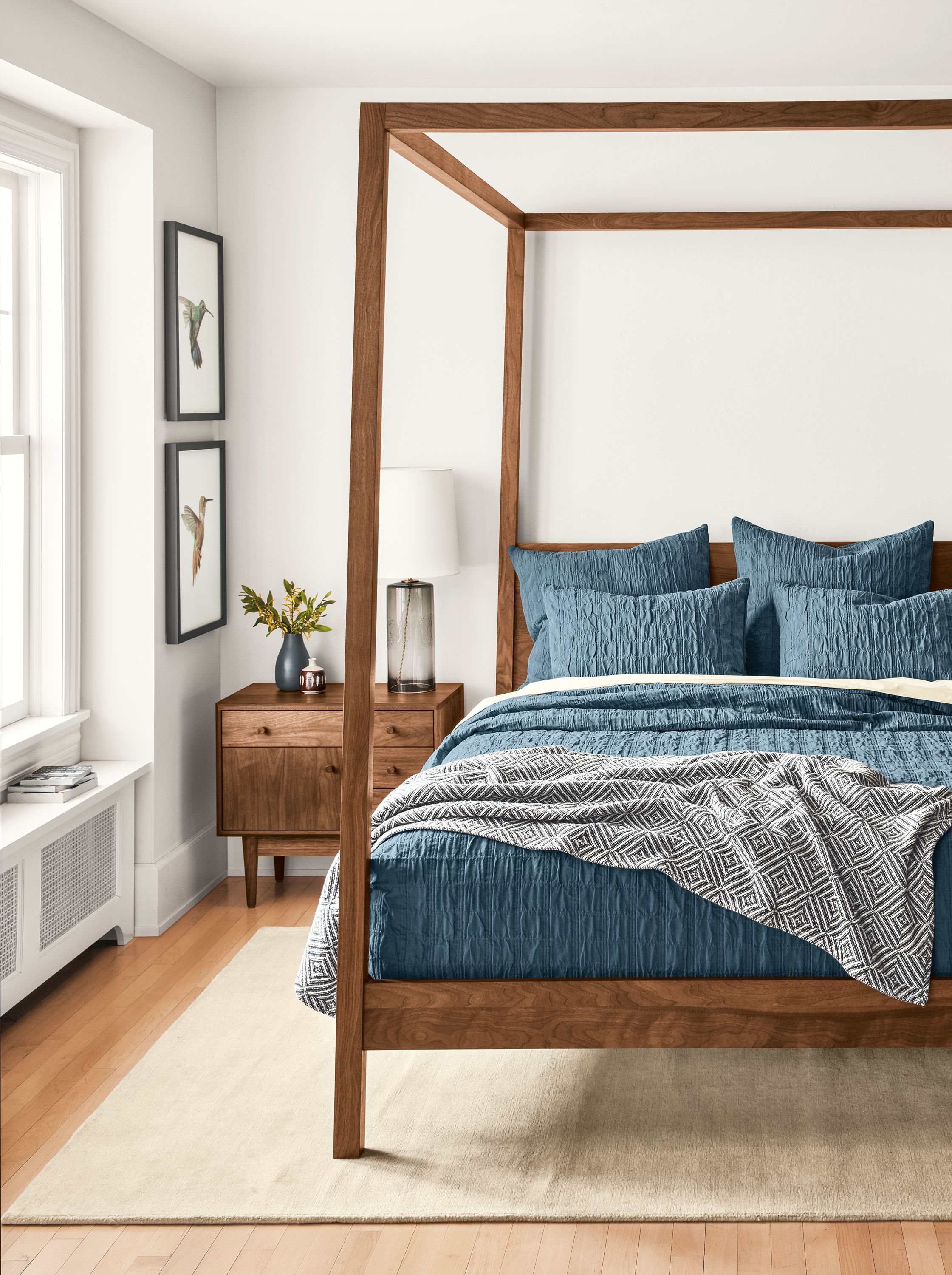 Bedroom with Marley coverlet and shams in Haze, Hale queen bed and grove nightstand in walnut.