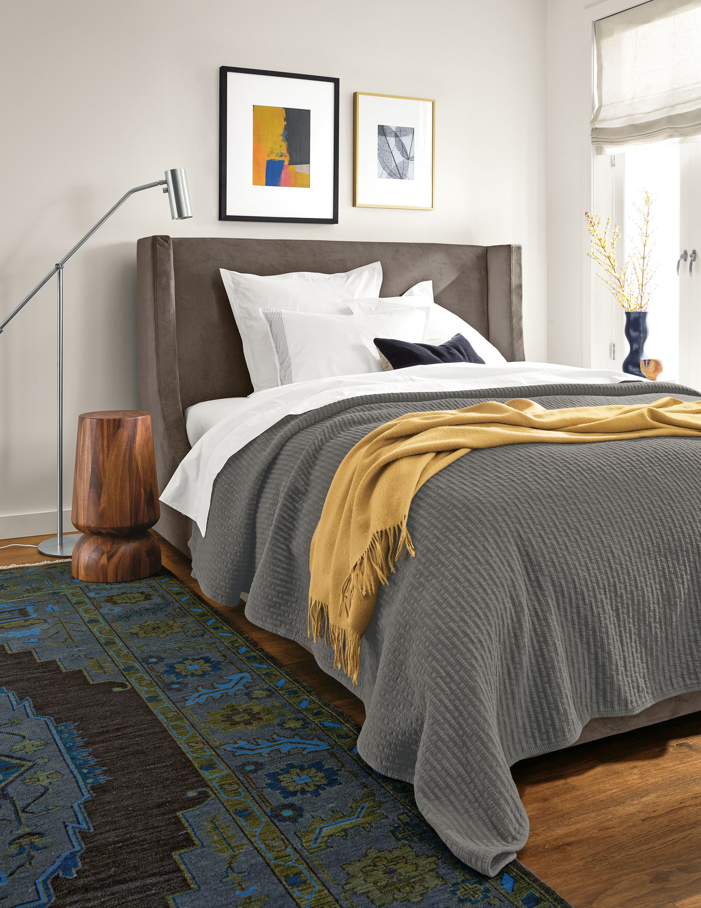 Bedroom with Marlo queen storage bed in View Otter, Nyla side table in conacaste and Horizon throw in mustard.