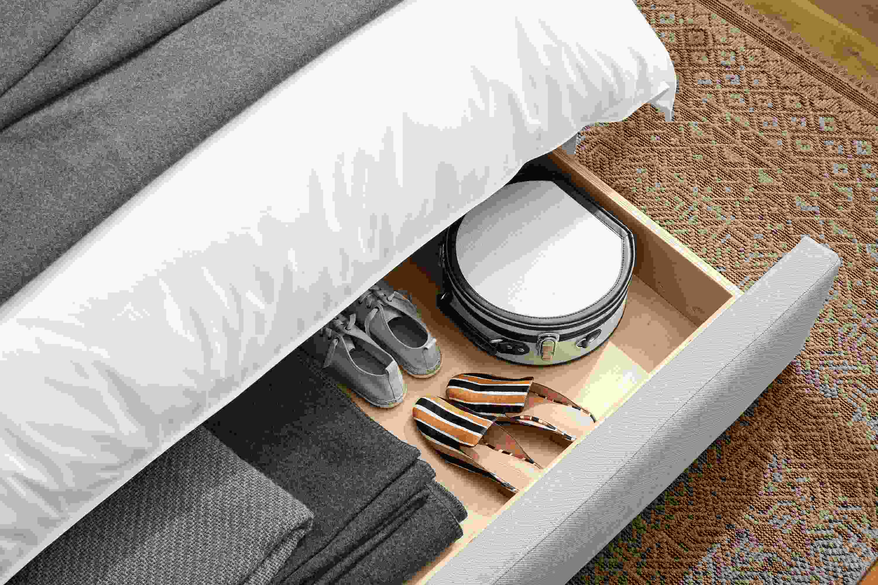 Marlo storage bed in Gino Oatmeal shown with drawer extended.