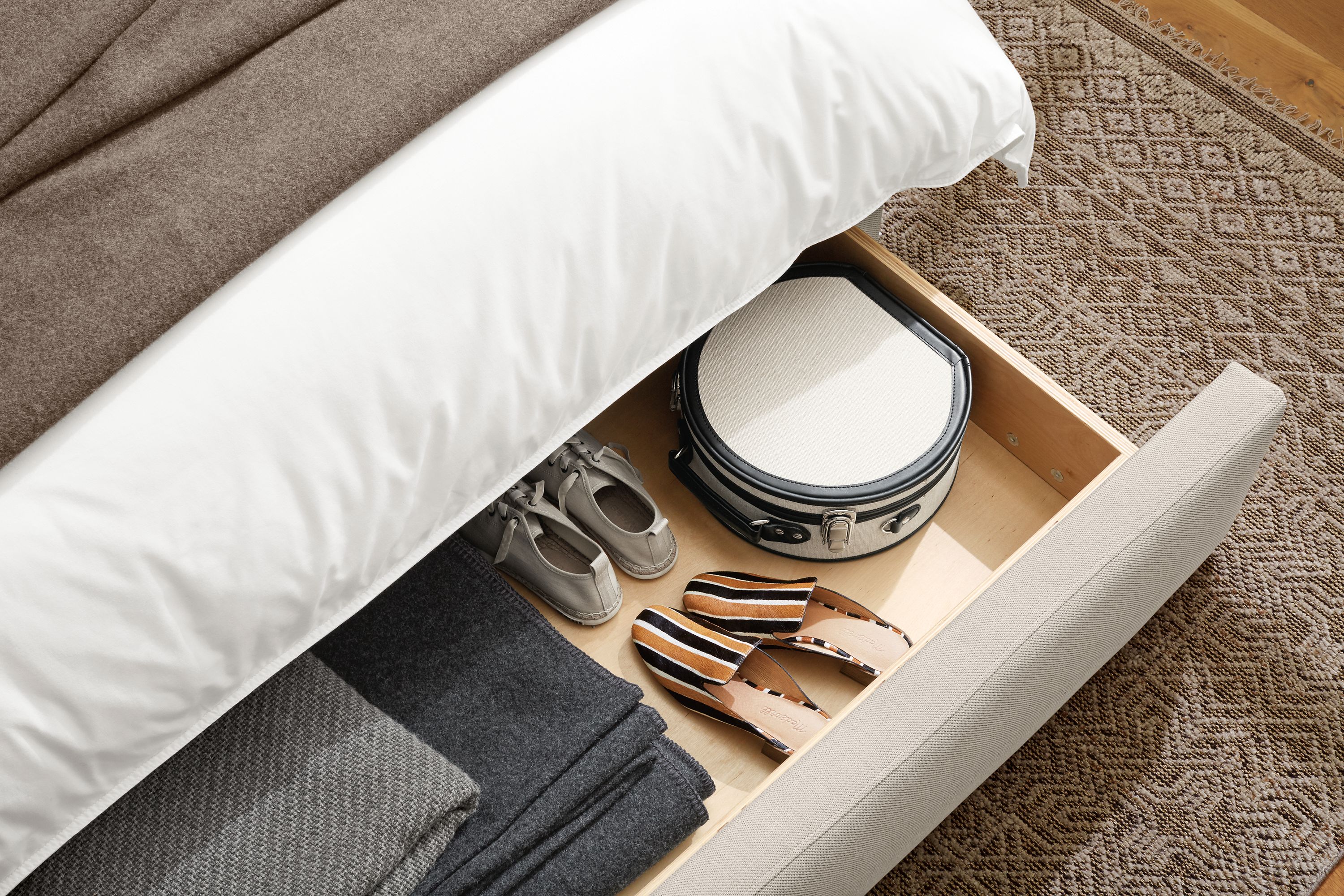 Marlo storage bed in Gino Oatmeal shown with drawer extended.