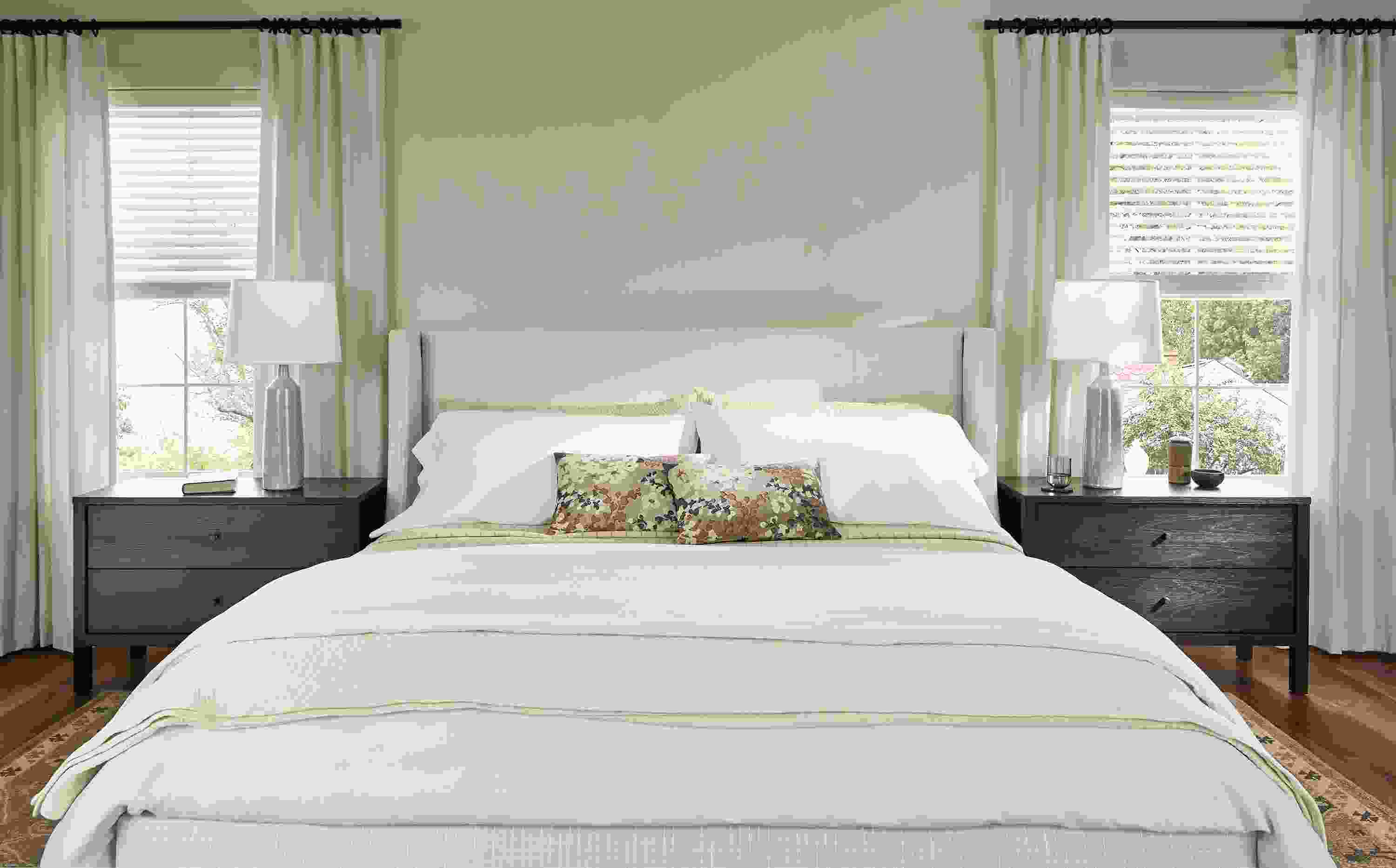 Bedroom with detail of Marlo king storage bed in Prado Natural and 2 Emerson nightstands in charcoal.