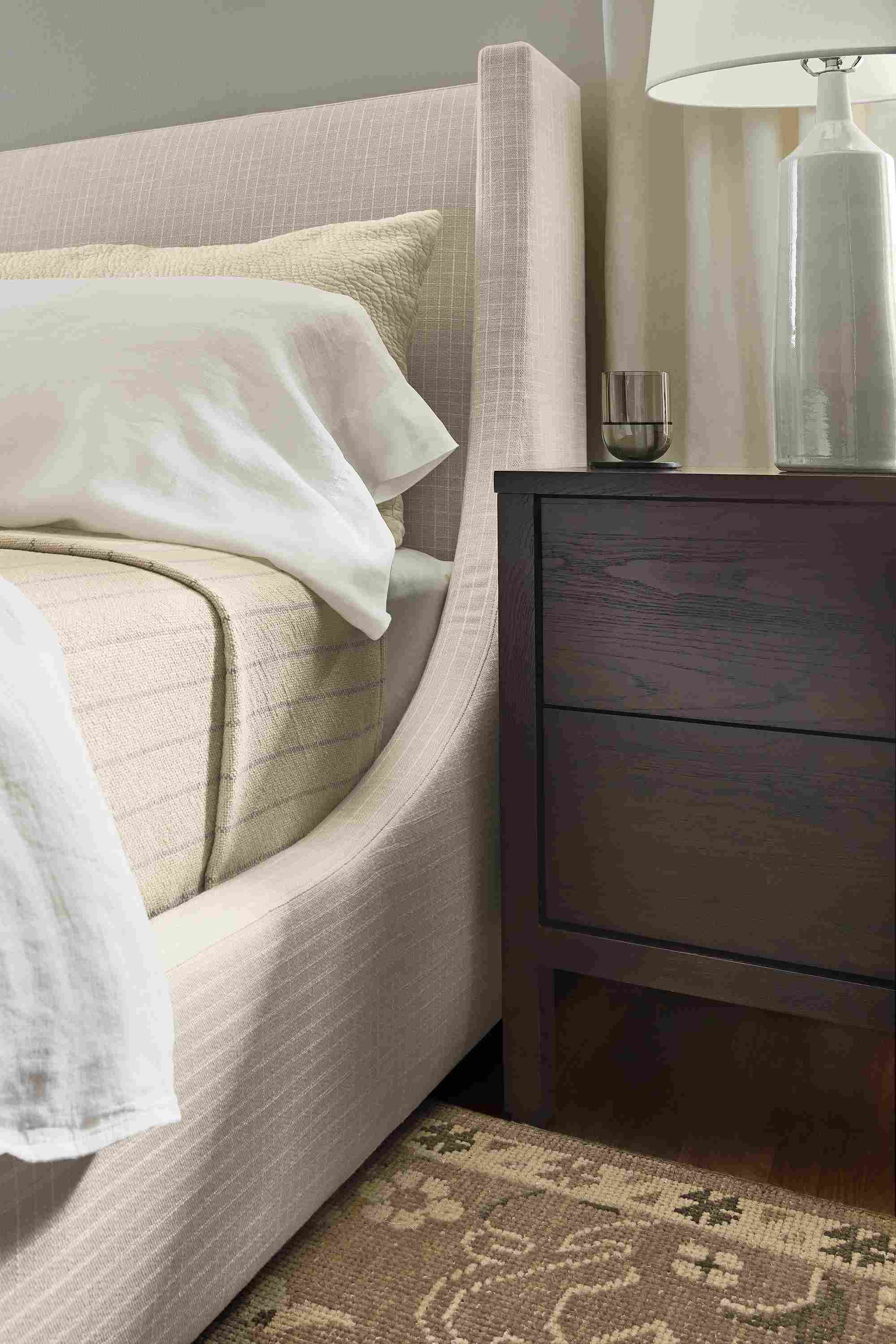 Bedroom with detail of Marlo storage bed in Prado Natural and Emerson nightstand in charcoal.