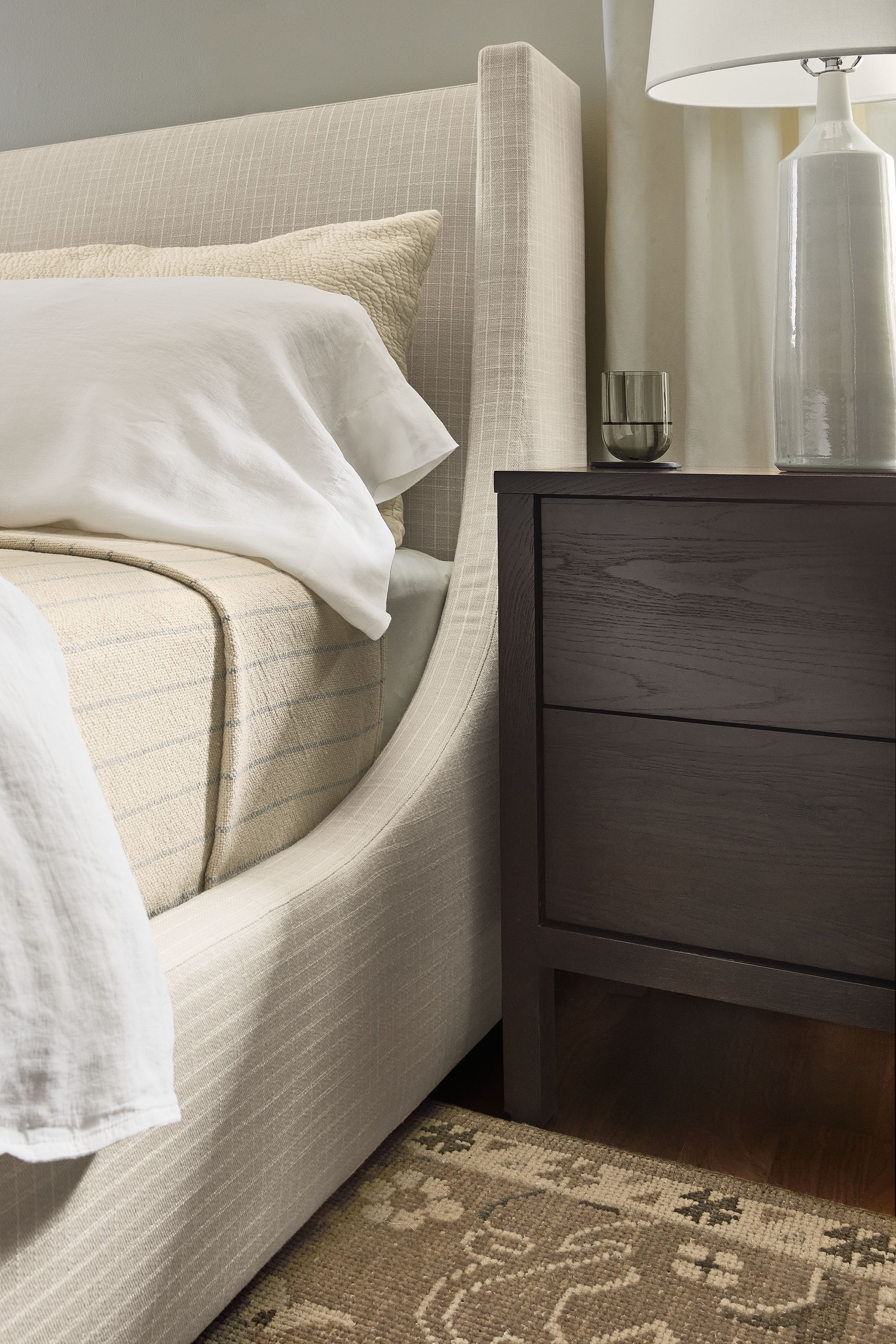 Bedroom with detail of Marlo storage bed in Prado Natural and Emerson nightstand in charcoal.