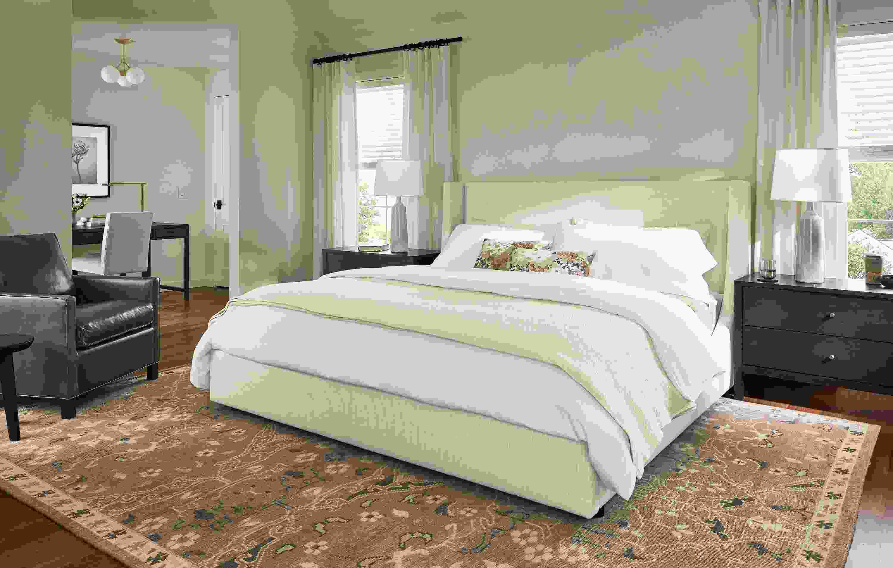 Bedroom with Marlo king storage bed in Prado Natural and Bram chair in Vento Smoke leather.