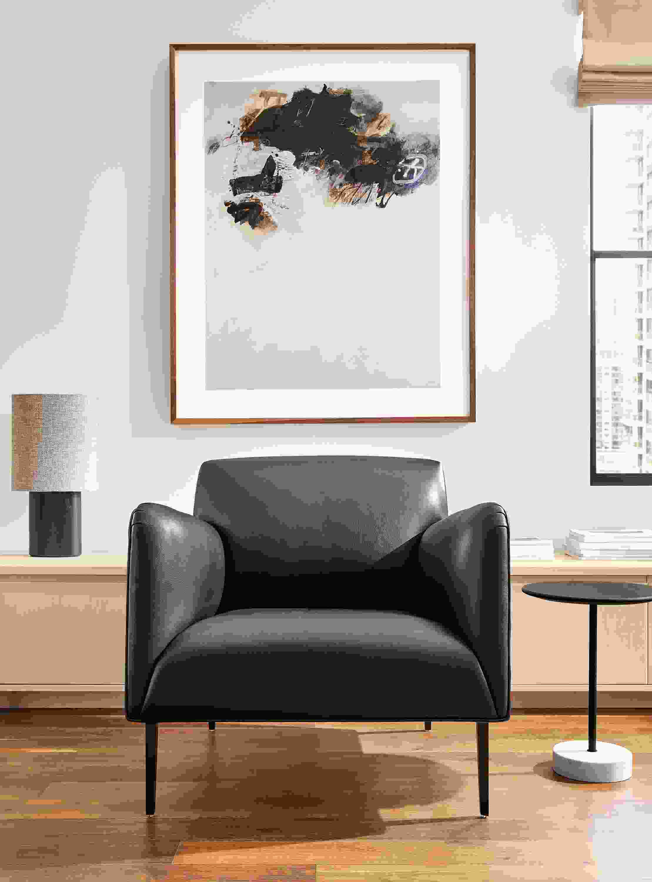 living room with matteo chair in urbino leather and gabriel belgeonne wall art.