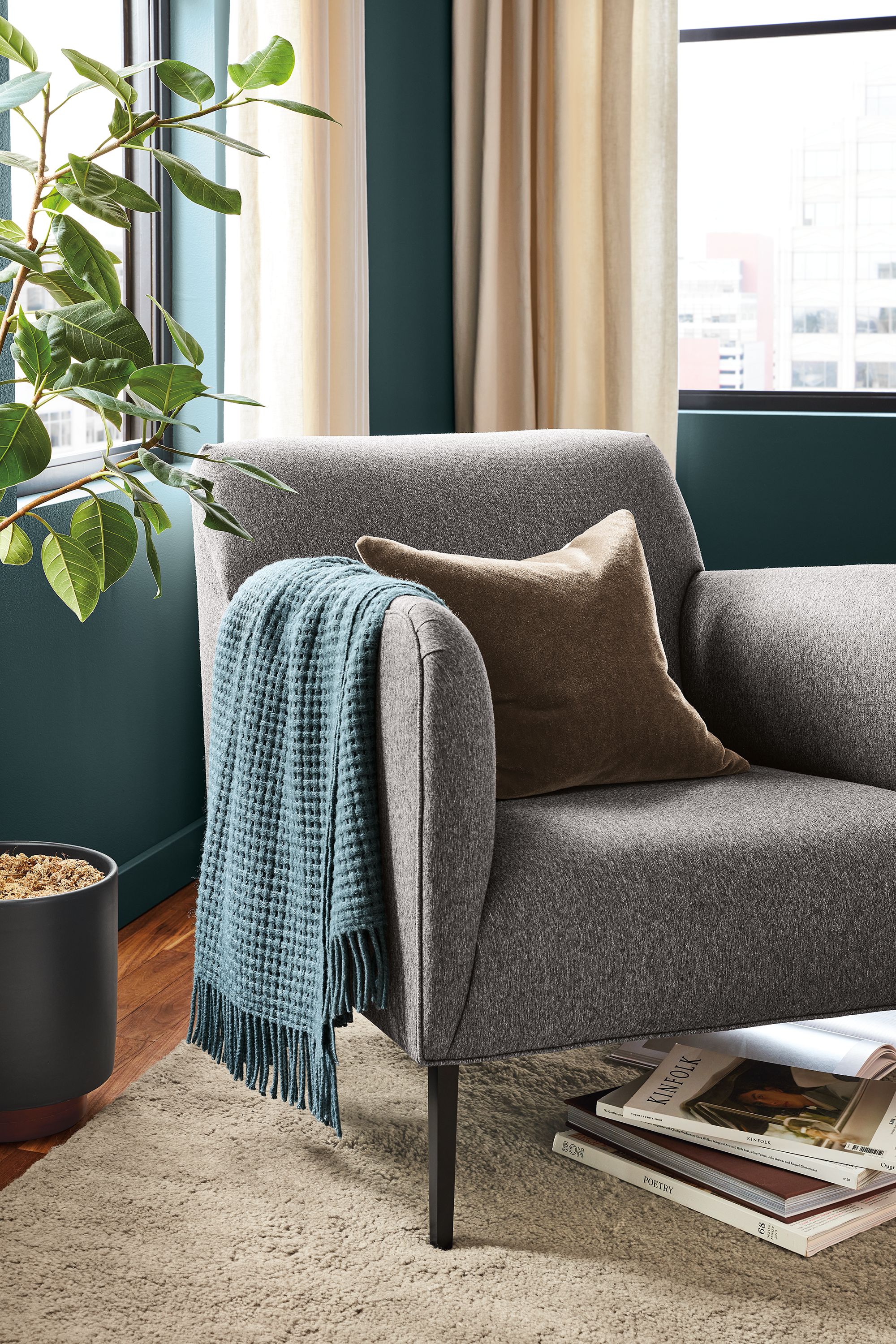 Detail of Matteo chair in flint gunmetal fabric in living room.