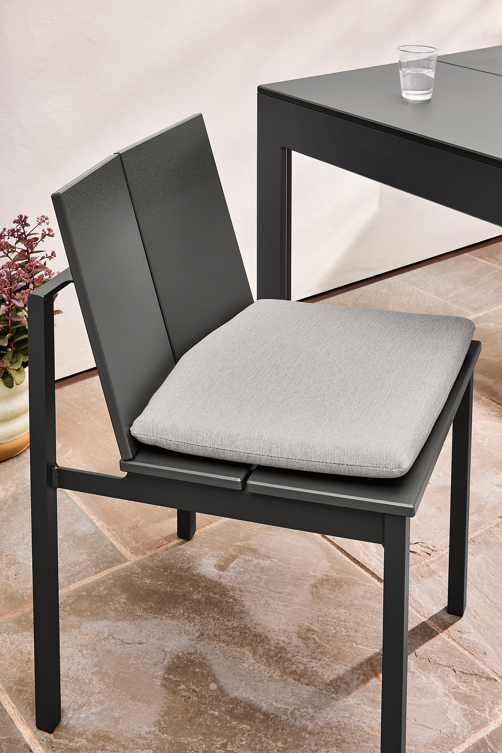 Outdoor space with mattix chair henry table in grey.