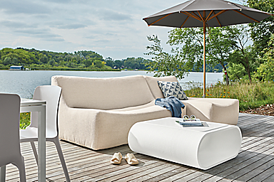 Maya 106-inch two piece outdoor sofa and chaise in Nevan Oatmeal fabric with Tangent 36-square outdoor coffee table in white.