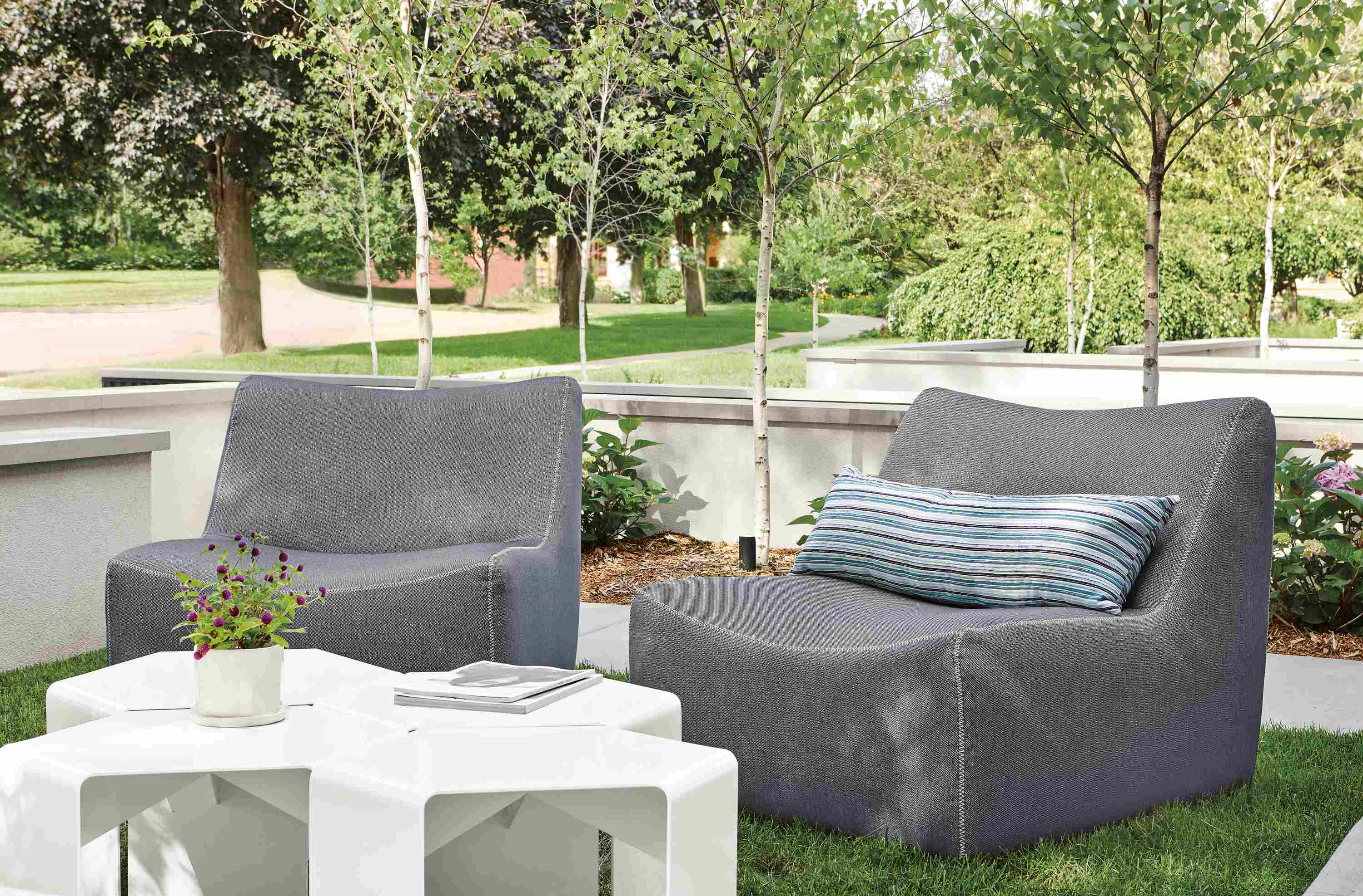 Detail of two Maya outdoor chairs in Mist navy fabric.