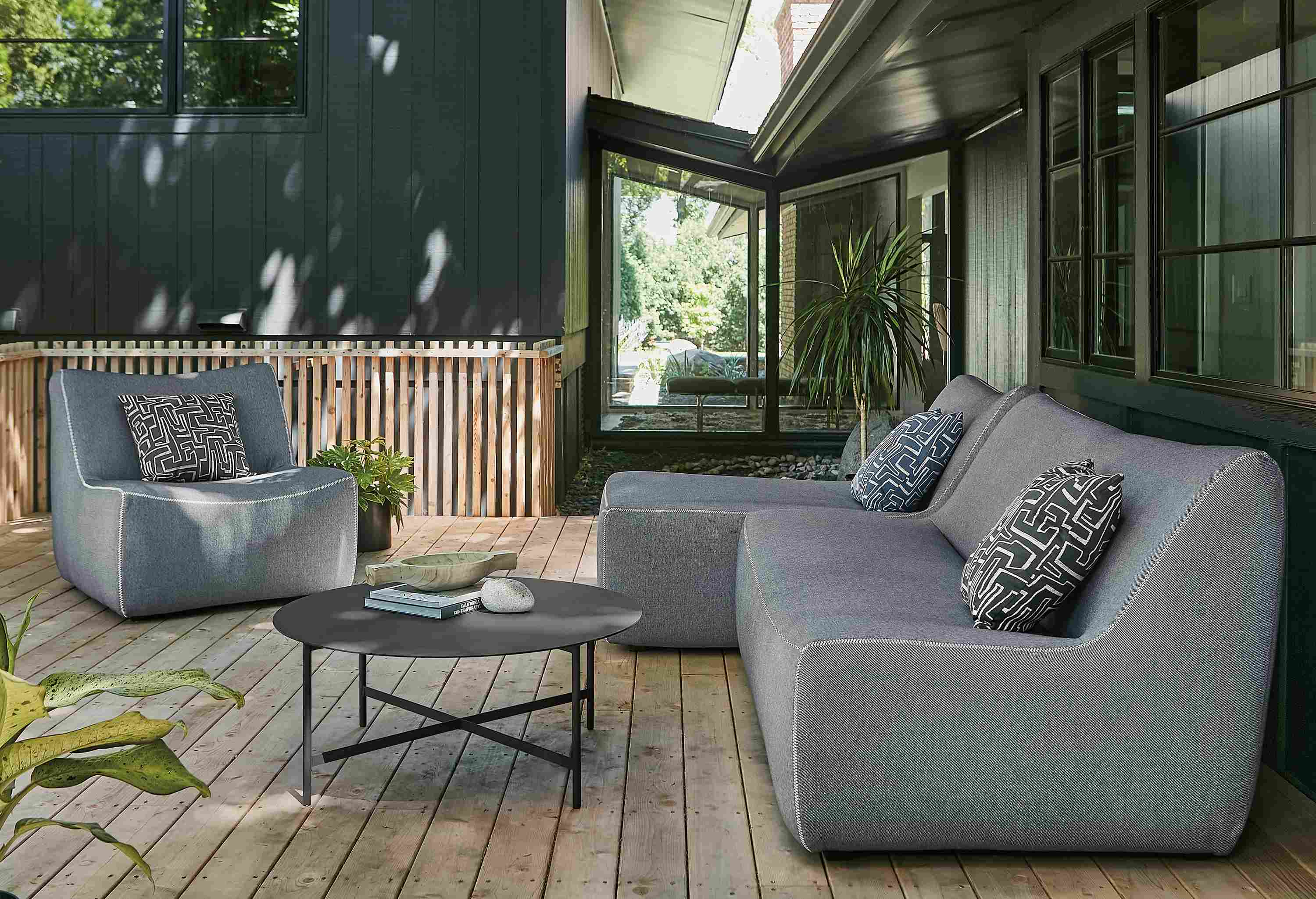 Outdoor space with maya two-piece modular sofa and maya chair.
