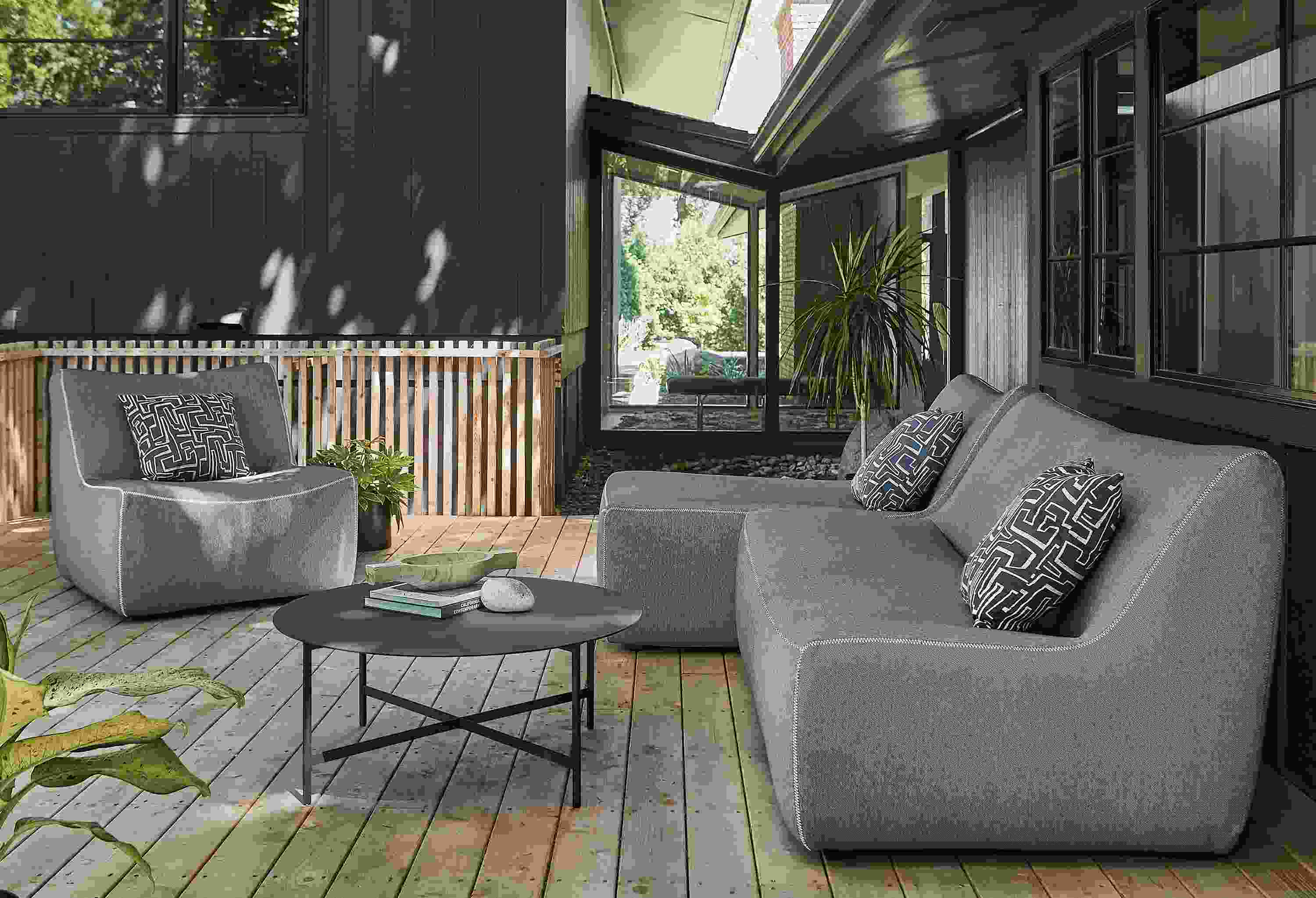 Outdoor space with maya two-piece modular sofa and maya chair.