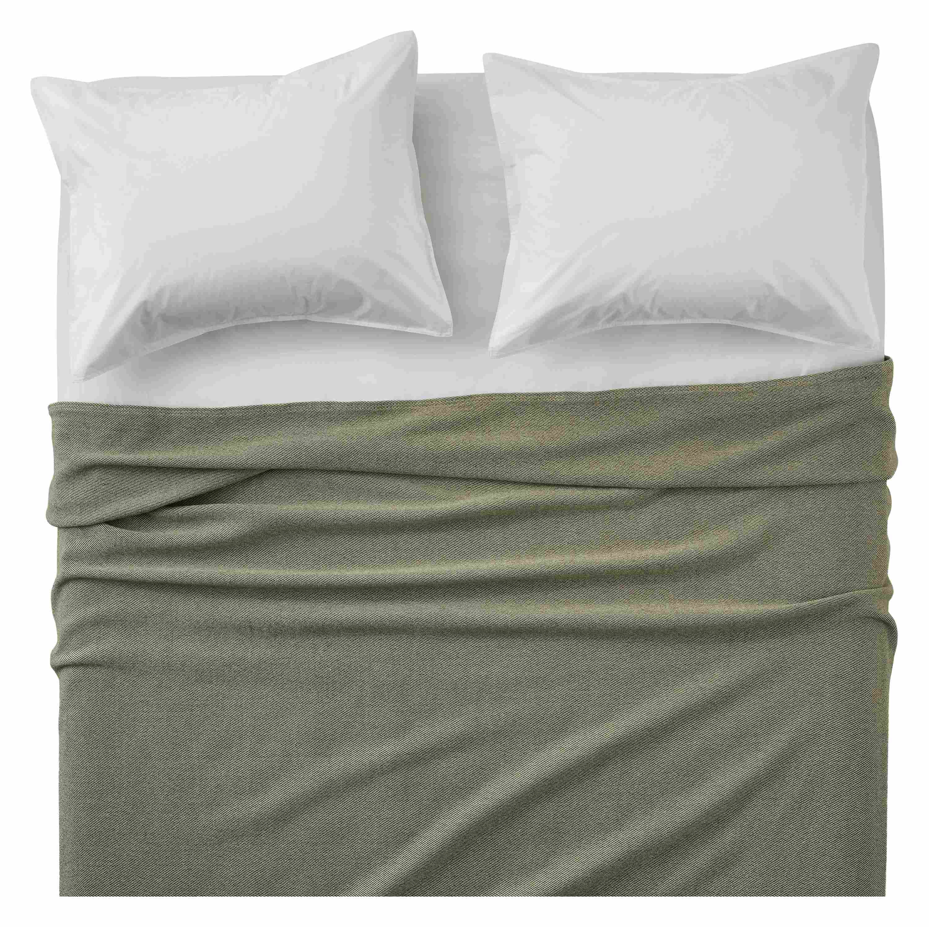 Overhead view of Mercer washable wool full/queen blanket in olive on a bed with signature percale sheets and sham in white.