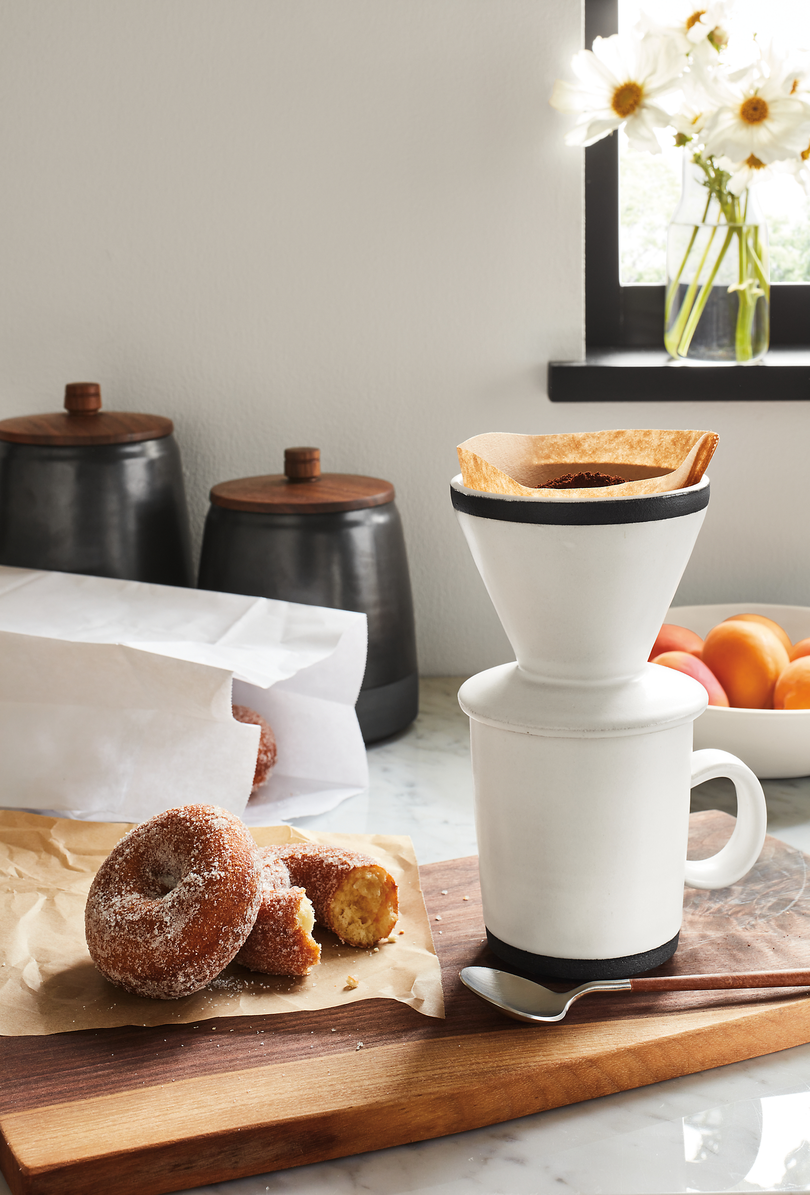 detail of Merrick Mug and Pour Over Set on cutting board with doughnut.