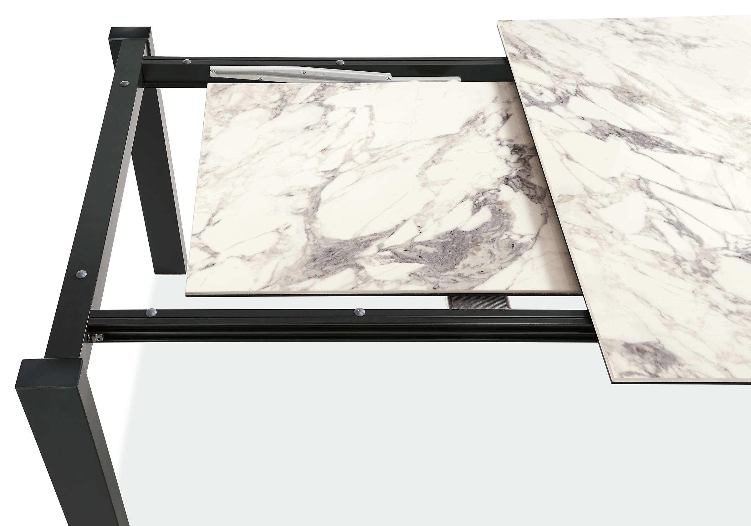 detail of metric extension table with marbled bright white ceramic top, with leaf exposed.
