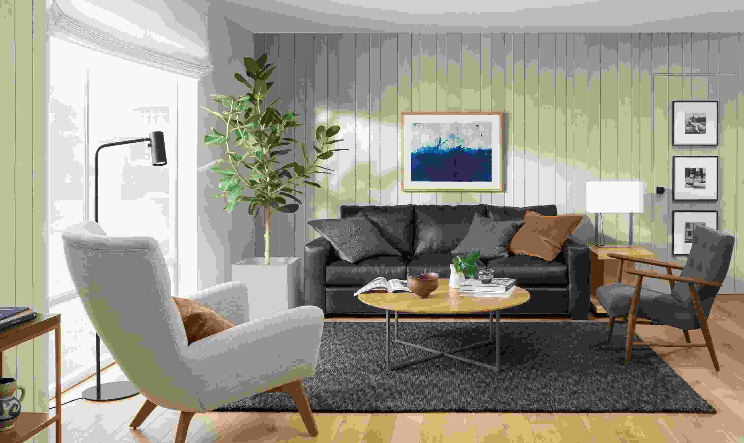 Detail of Metro three-cushion sofa in Portofino Ink leather in living room.