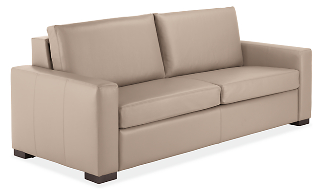 angled view of metro foldout sleeper sofa in urbino stone leather.