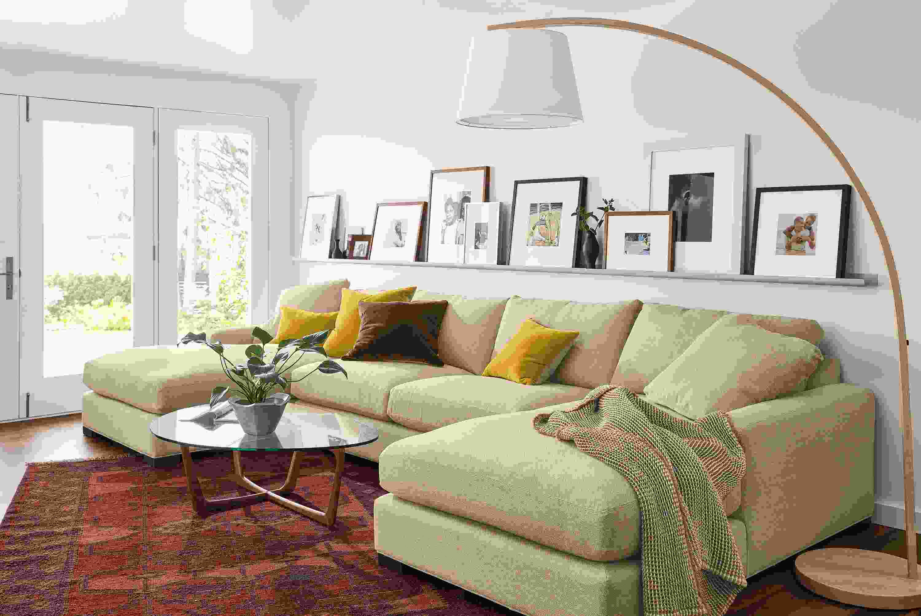 Living area with Metro U-shaped sectional in tatum oatmeal and Dunn coffee table in walnut with glass top.