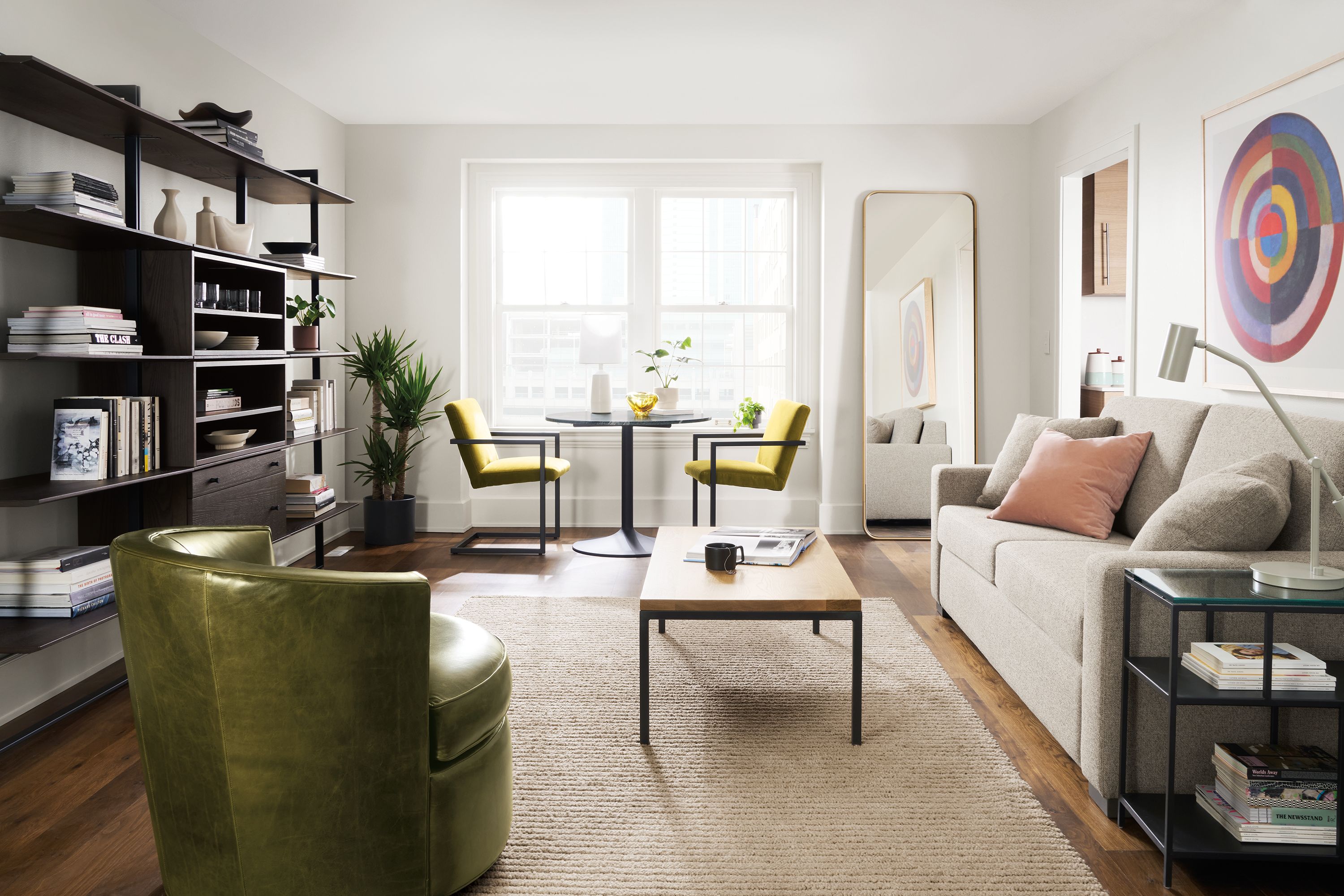 living room including metro sleeper sofa, otis swivel chair, parsons coffee table, arden rug.