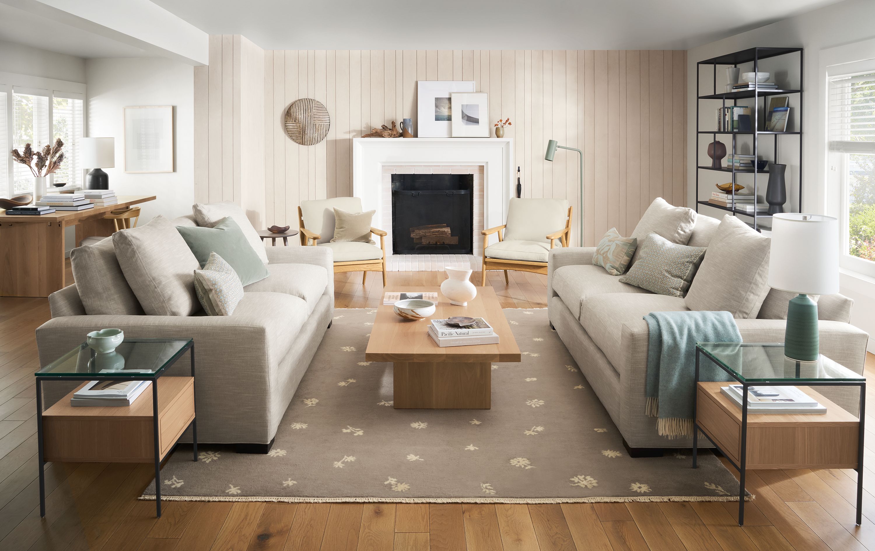 Living room with fireplace, ericson chairs in laino bone in destin linen, metro sofas, tansy rug, corbett coffee table.