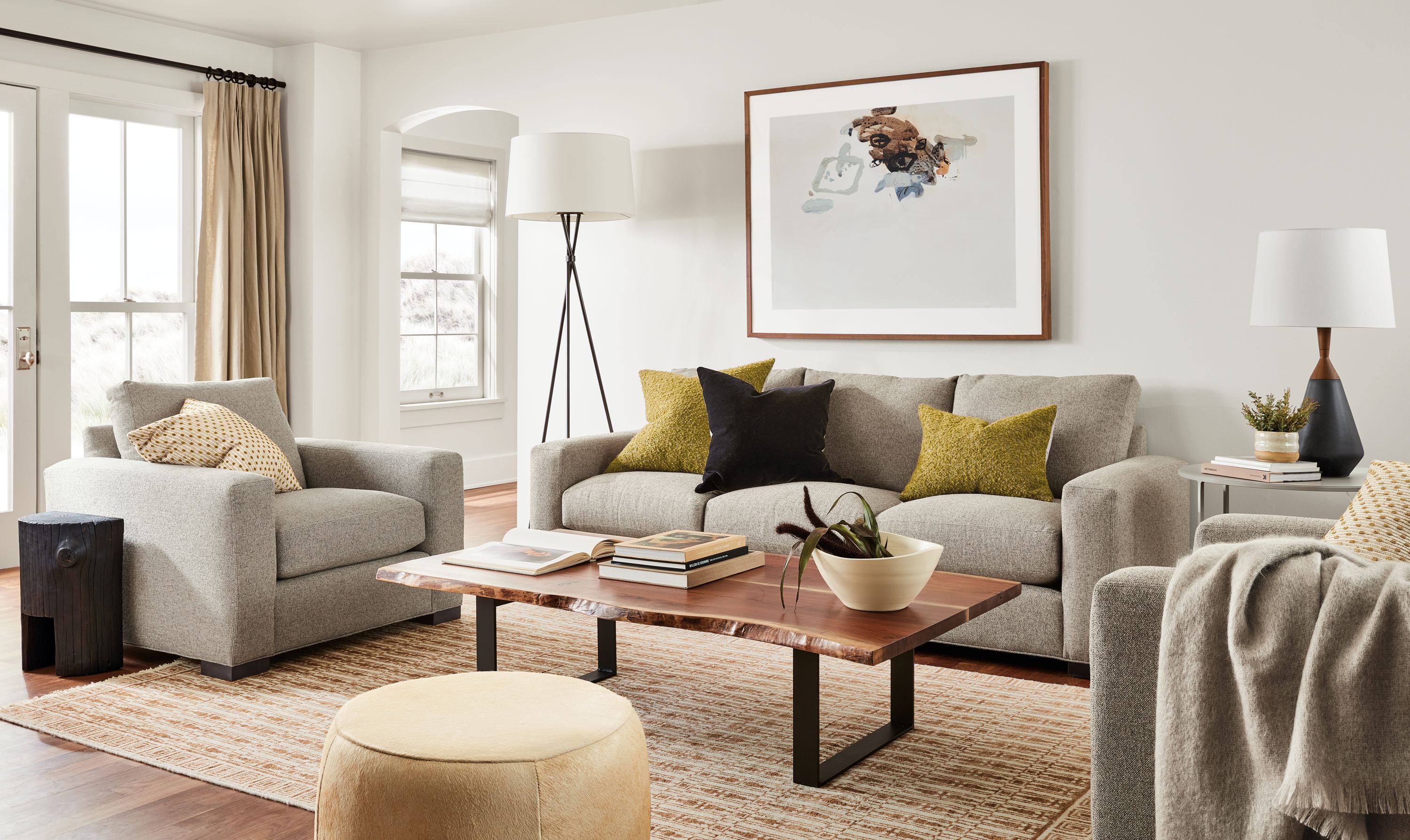 Metro 88-wide Three-Cushion Sofa and Chair in Tatum Fabric, Lind 20-round Ottoman in Cowhide Buff and Chilton Coffee Table.