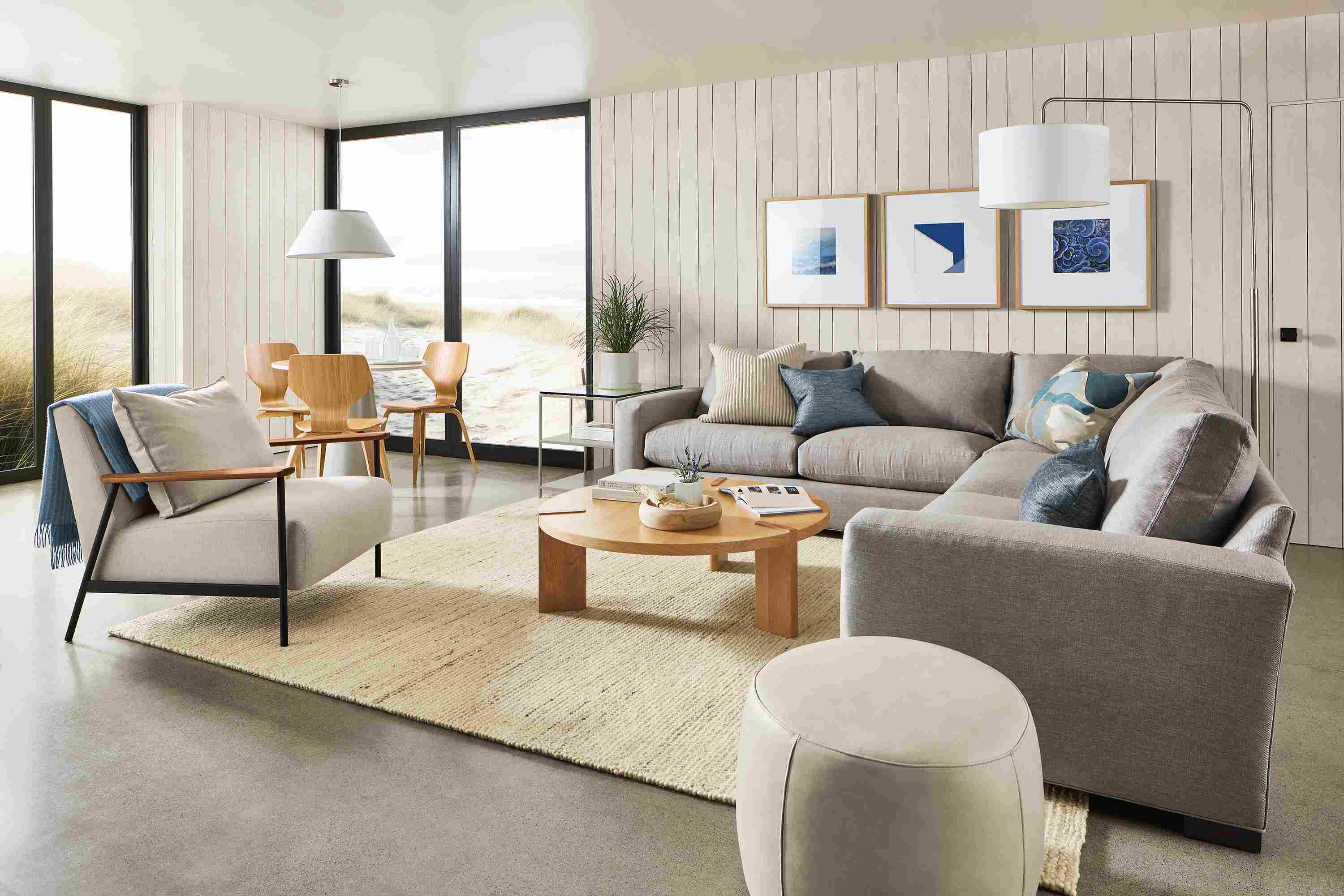 living room with metro sectional, xavier chair, three profile frames.